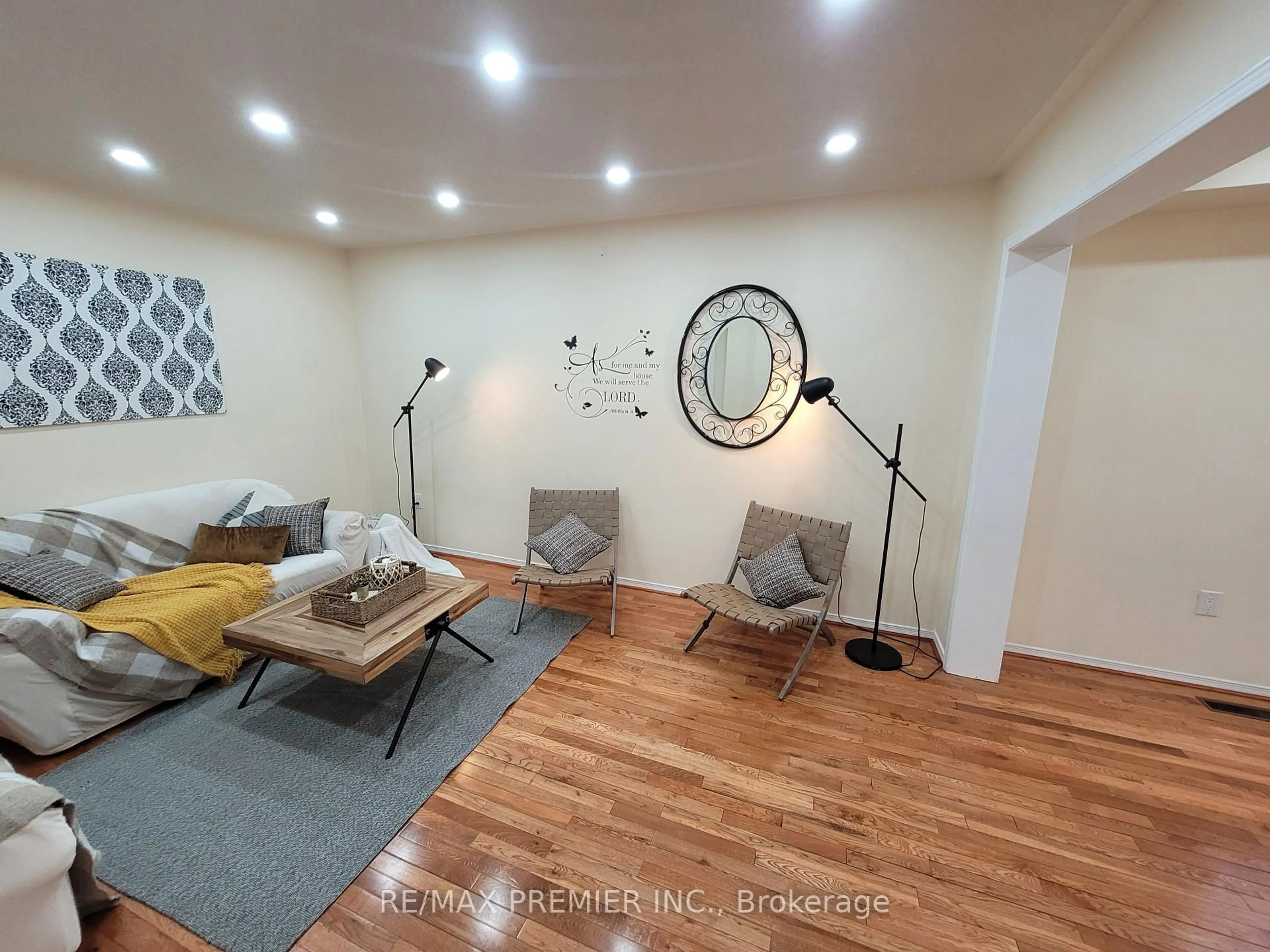 Living room with furniture, wood/laminate floor for 40 Kentucky Dr, Brampton Ontario L6Y 4E9