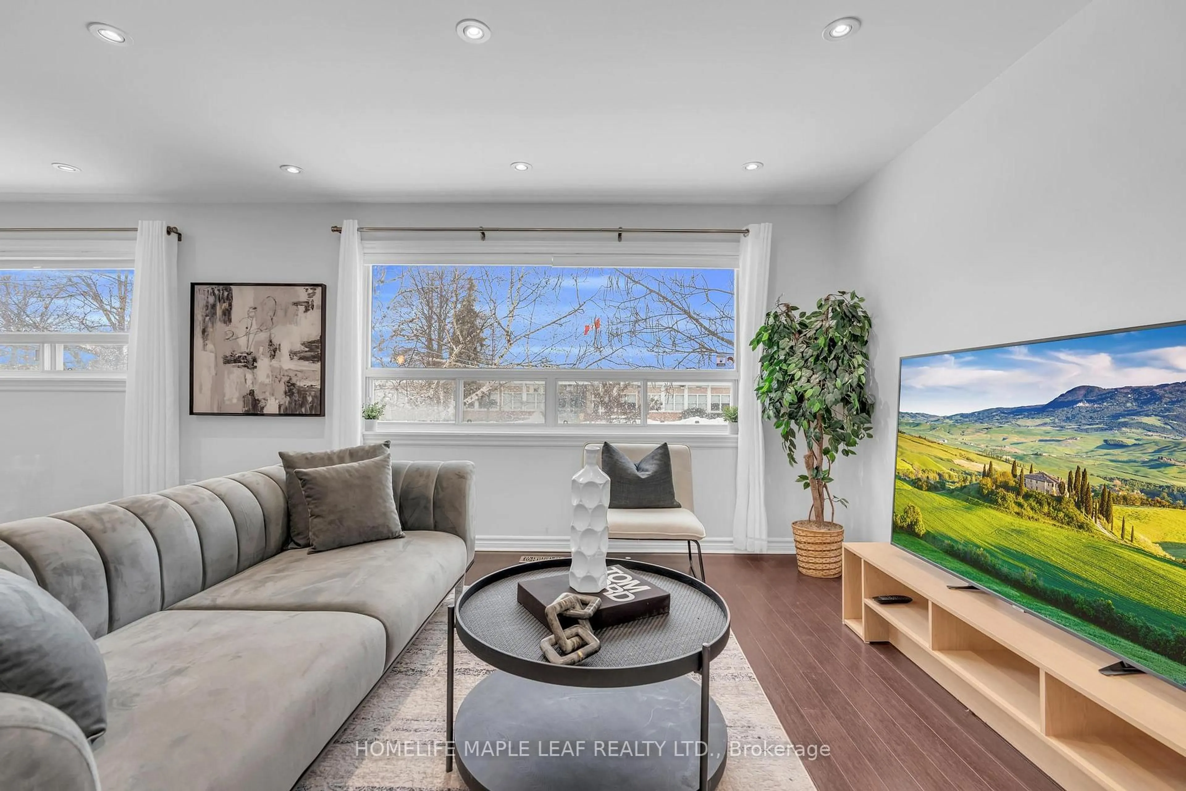 Living room with furniture, wood/laminate floor for 12 Abbey Rd, Brampton Ontario L6W 2T8