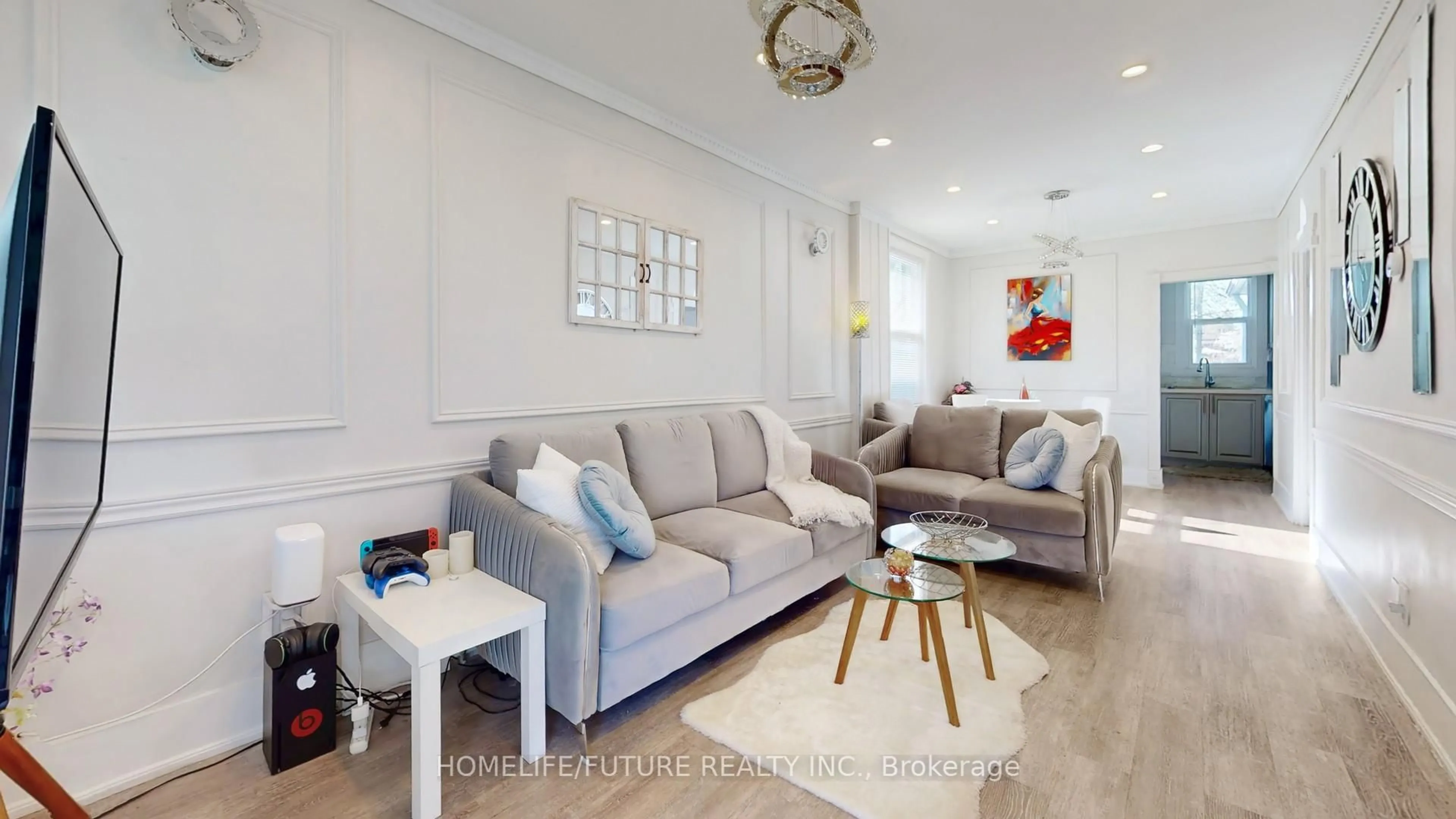 Living room with furniture, wood/laminate floor for 82 Heman St, Toronto Ontario M8V 1X5