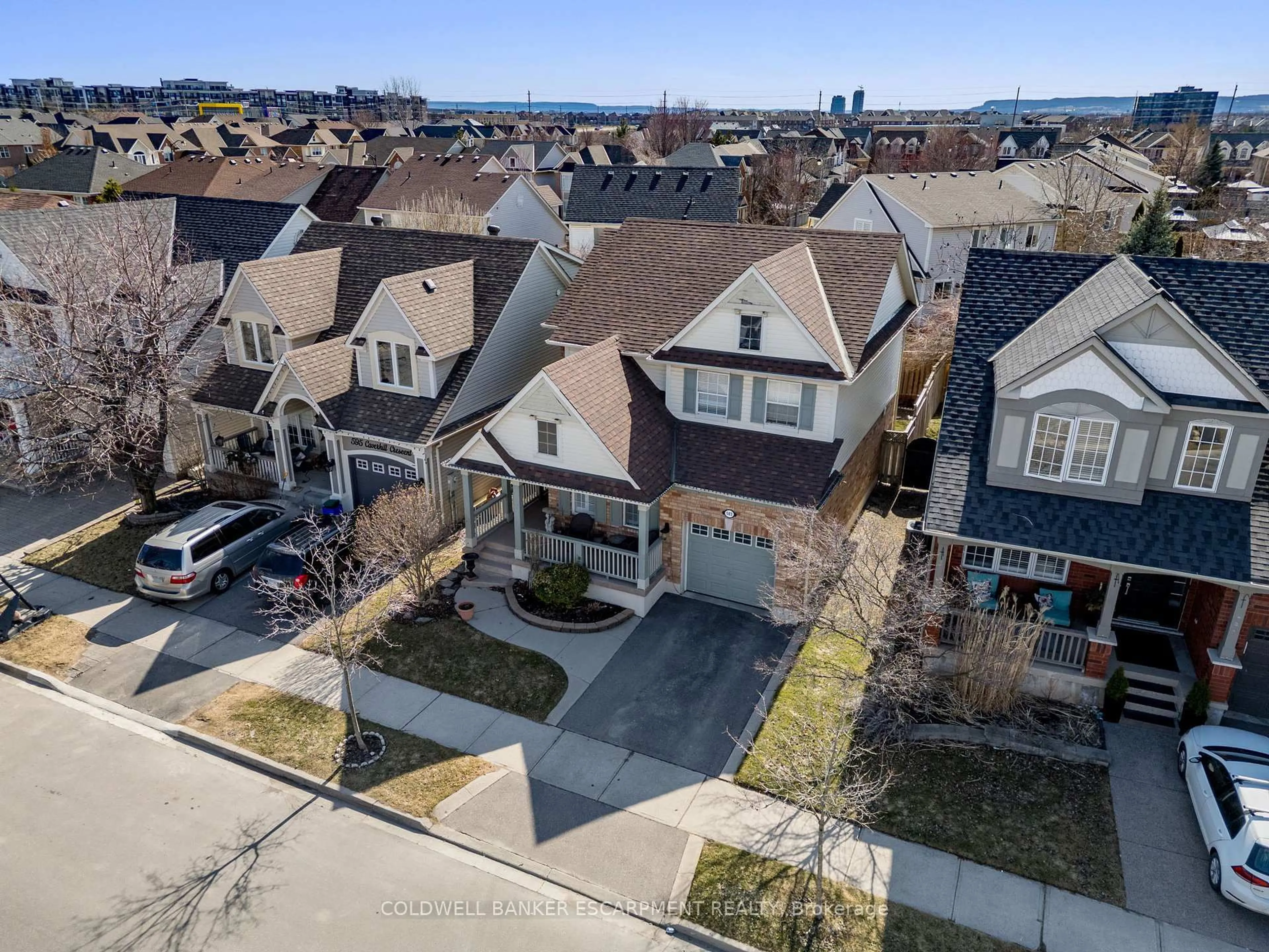 A pic from outside/outdoor area/front of a property/back of a property/a pic from drone, street for 593 Caverhill Cres, Milton Ontario L9T 5K1