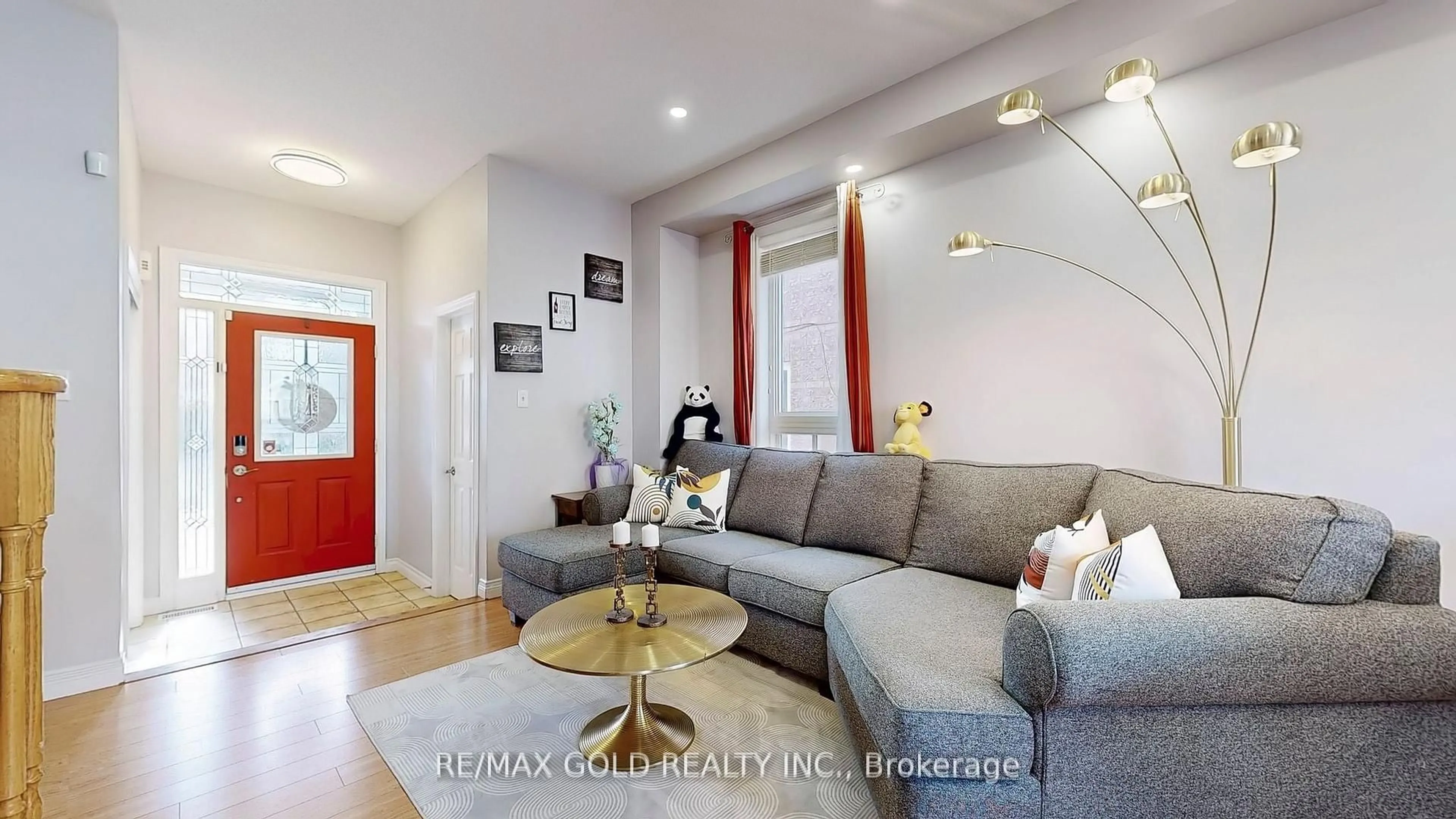 Living room with furniture, wood/laminate floor for 32 Ashdale Rd, Brampton Ontario L6Y 5M7