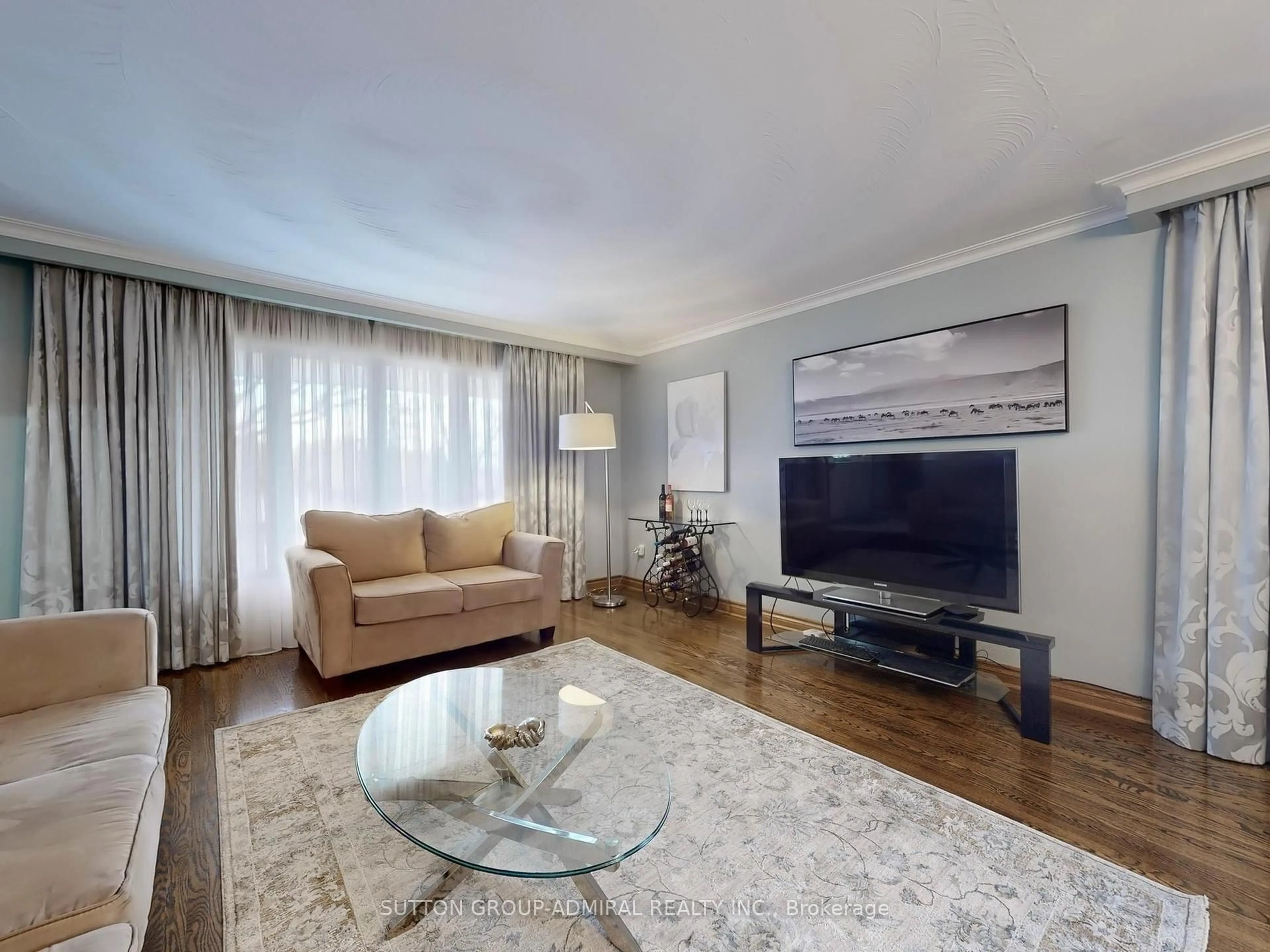 Living room with furniture, wood/laminate floor for 36 Bluehaven Cres, Toronto Ontario M9M 1W5