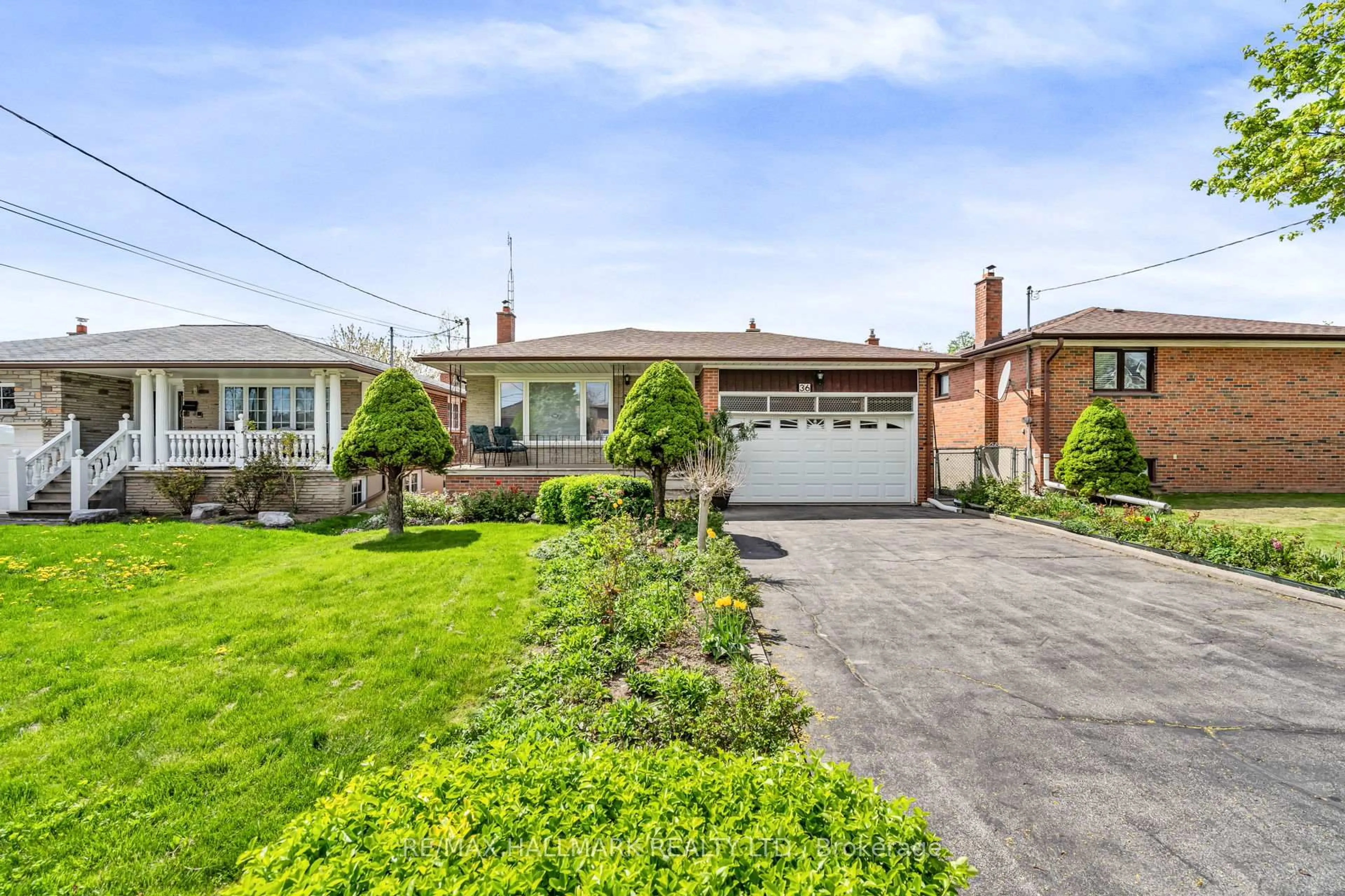 Home with brick exterior material, street for 36 Jasmine Rd, Toronto Ontario M9M 2P9