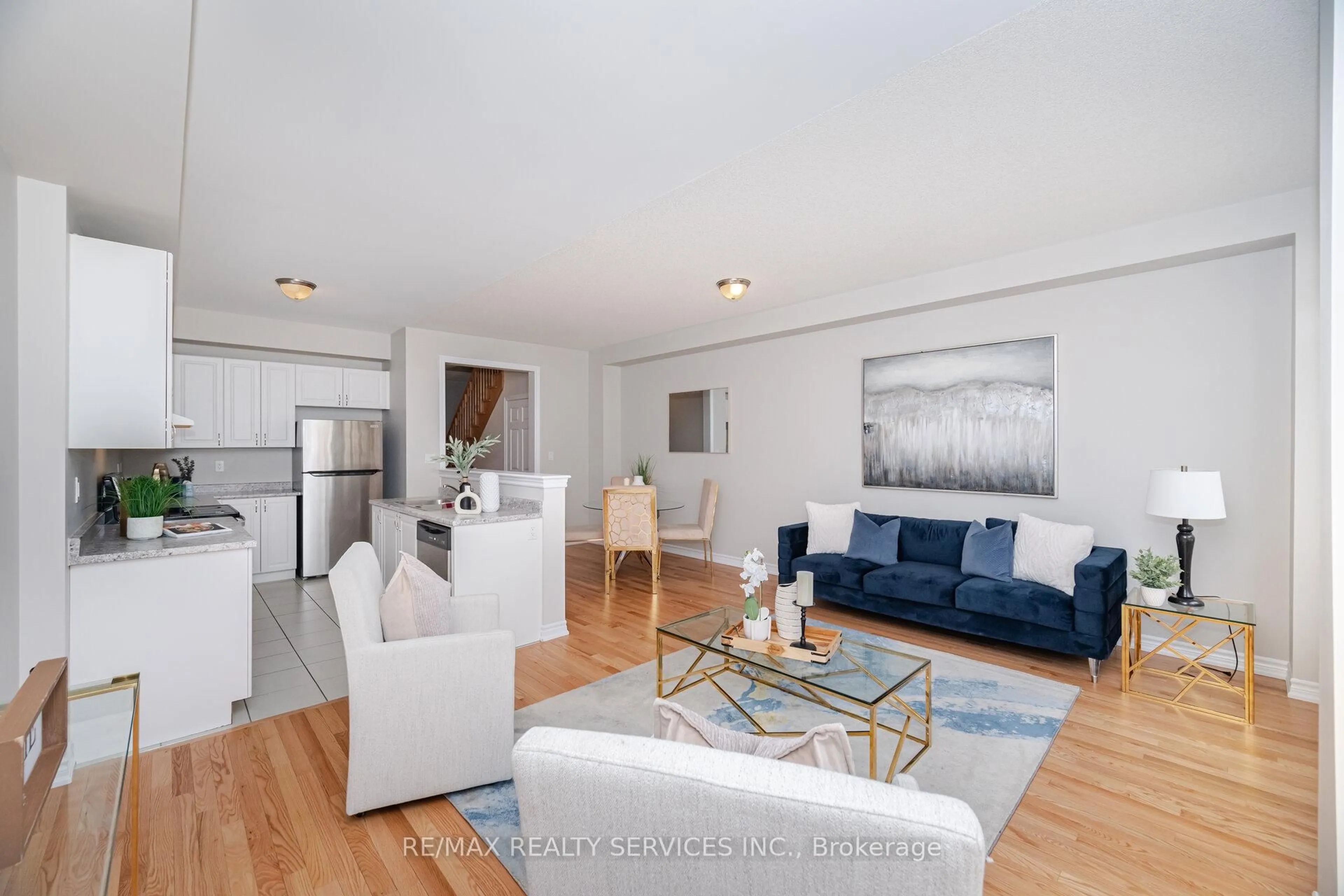 Living room with furniture, wood/laminate floor for 93 Royal Fern Cres, Caledon Ontario L7C 4G9