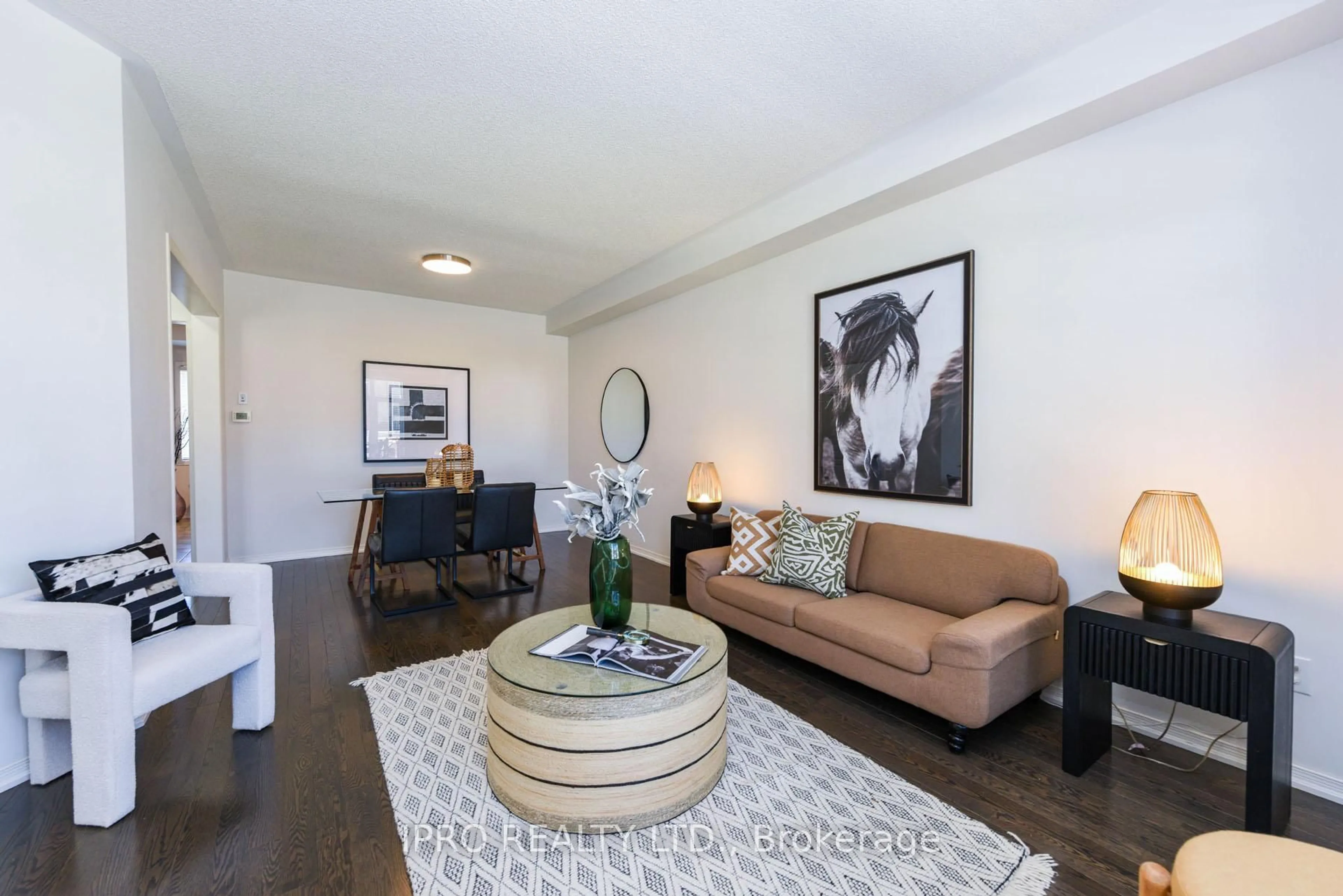 Living room with furniture, wood/laminate floor for 16 Sixteen Mile Dr, Oakville Ontario L6M 0S9