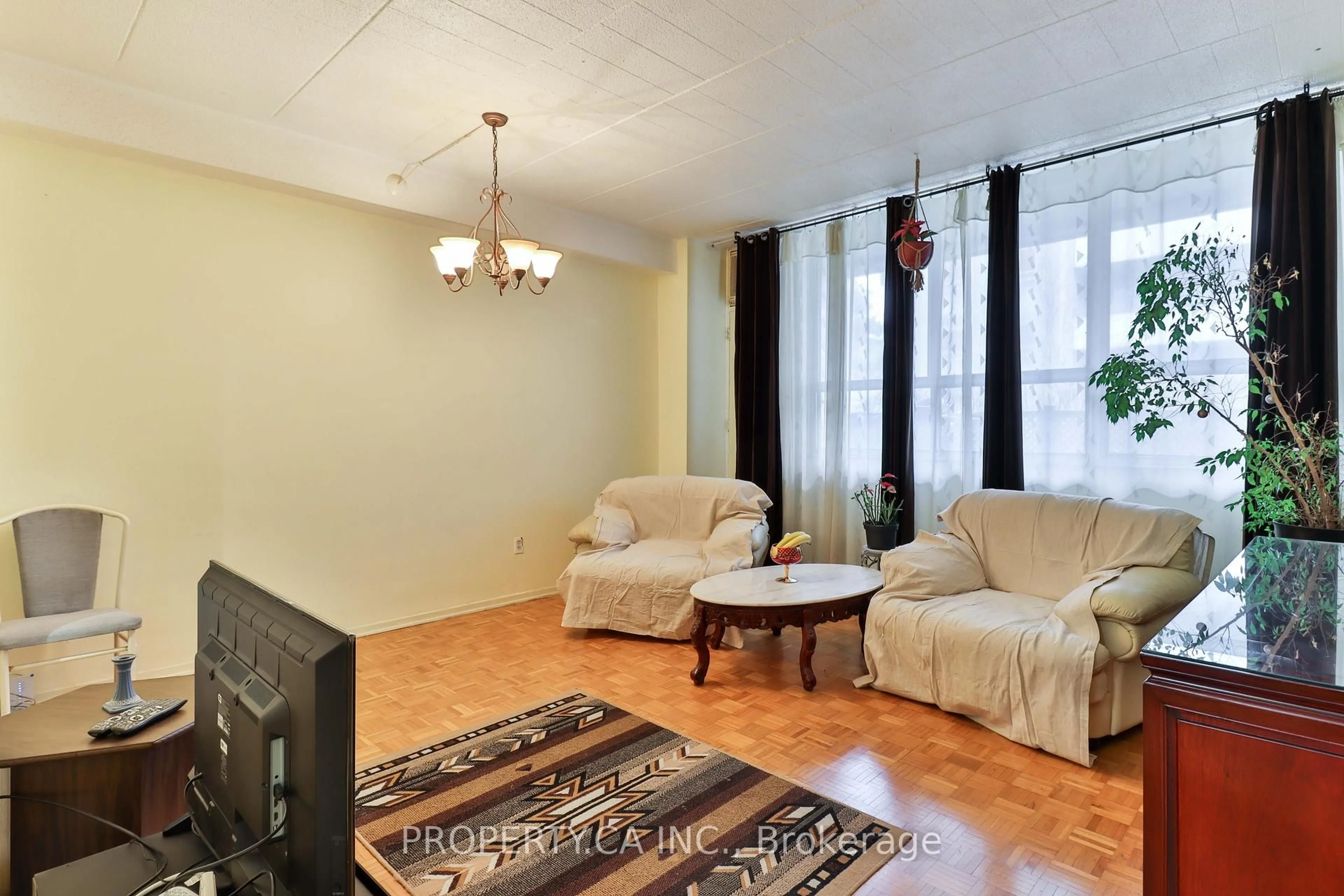 Living room with furniture, unknown for 3625 Lakeshore Blvd #108, Toronto Ontario M8W 4W2