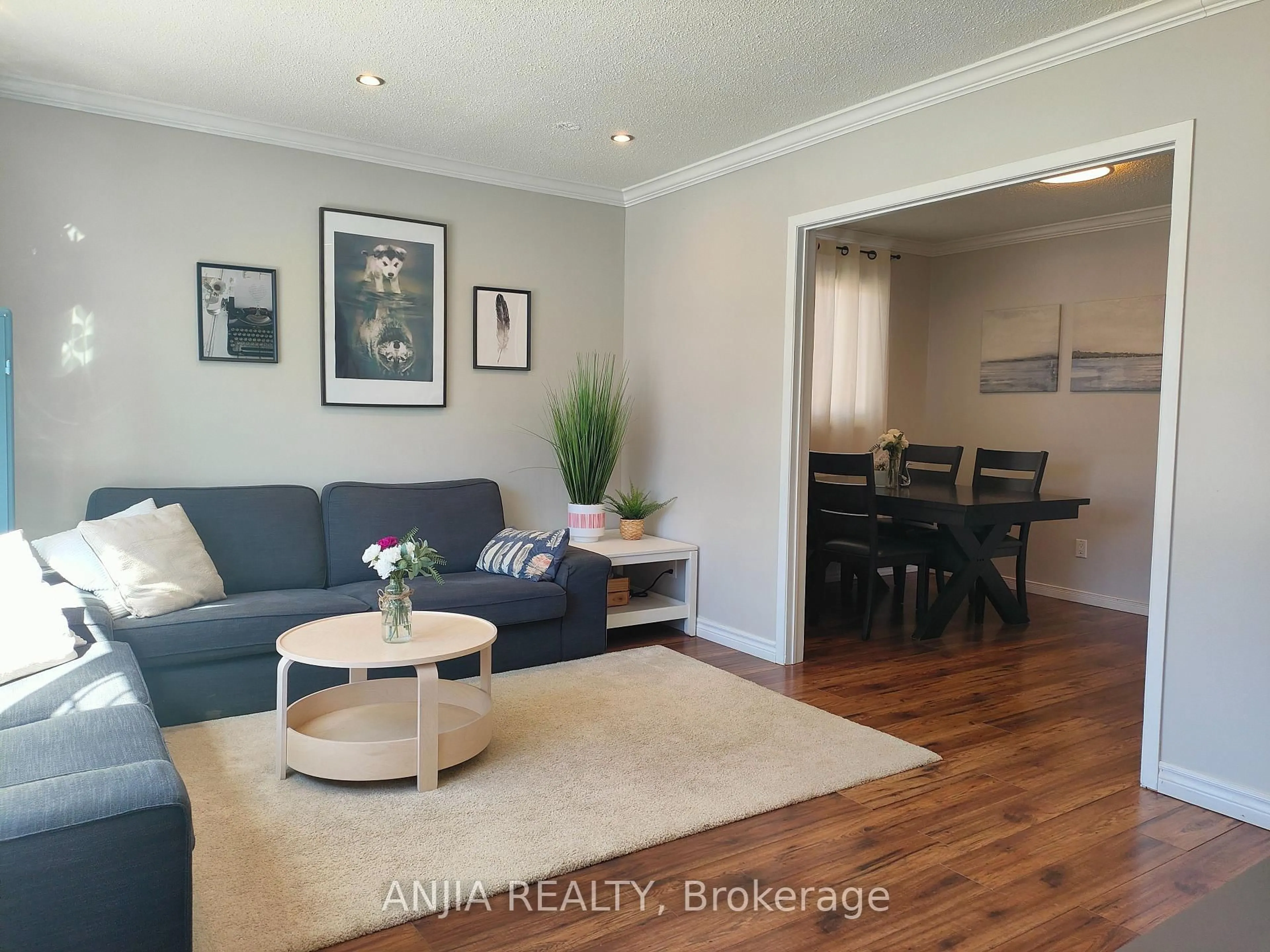 Living room with furniture, wood/laminate floor for 2271 Sheffield Dr, Burlington Ontario L7P 2X4