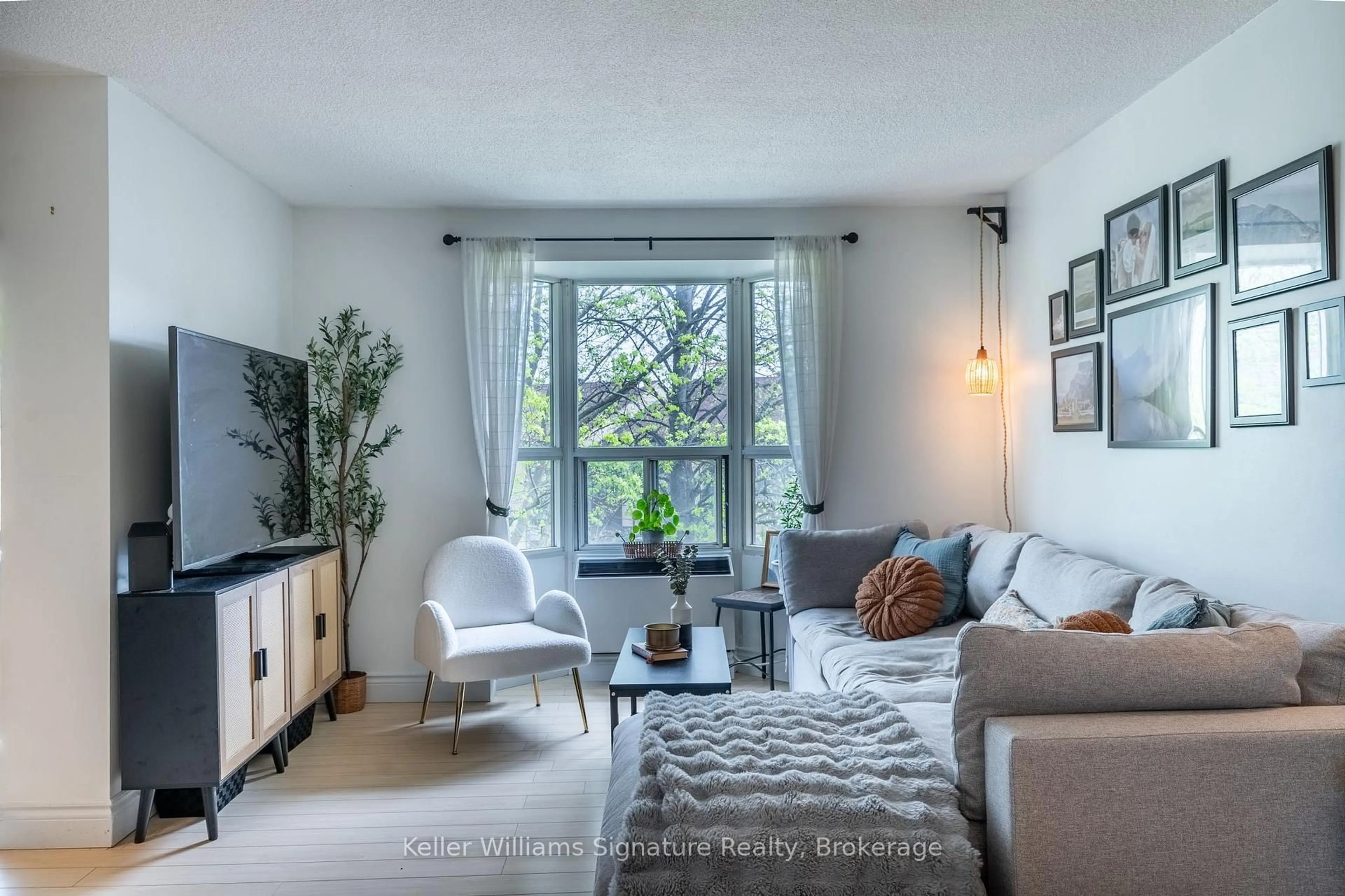 Living room with furniture, unknown for 3835 Lake Shore Blvd #305, Toronto Ontario M8W 1R2