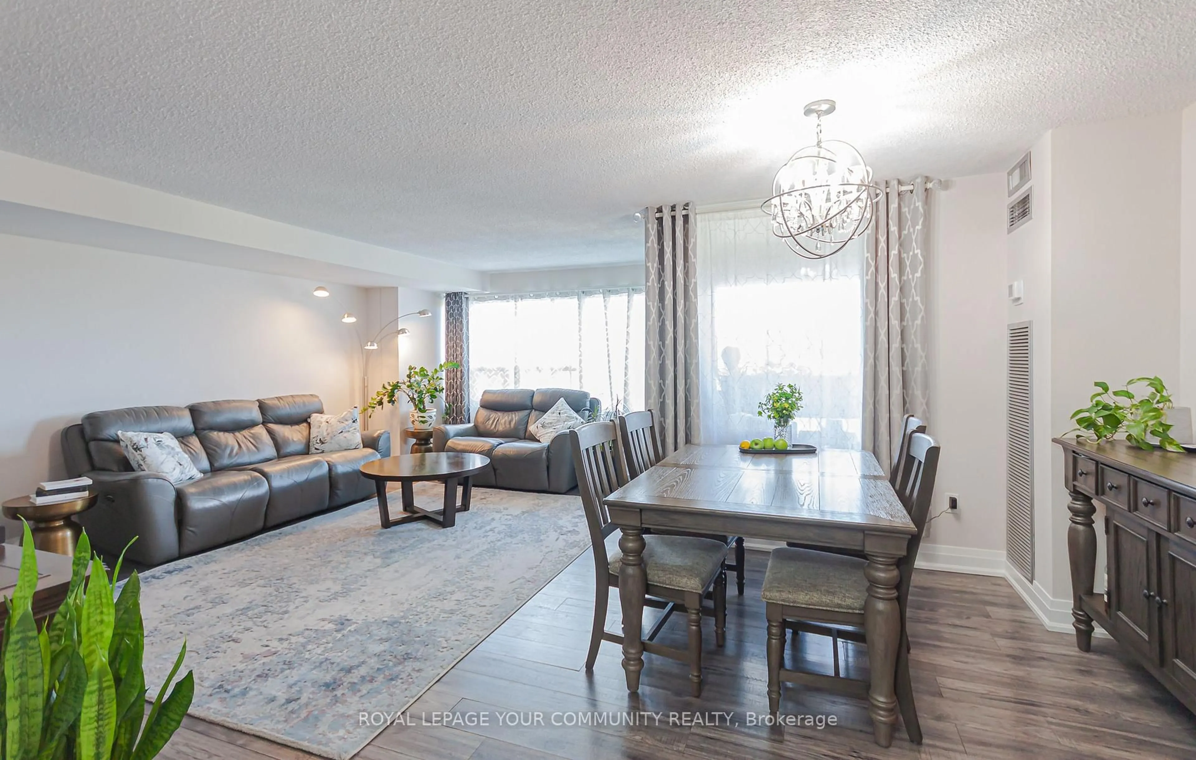 Living room with furniture, wood/laminate floor for 475 The West Mall N/A #714, Toronto Ontario M9C 4Z3