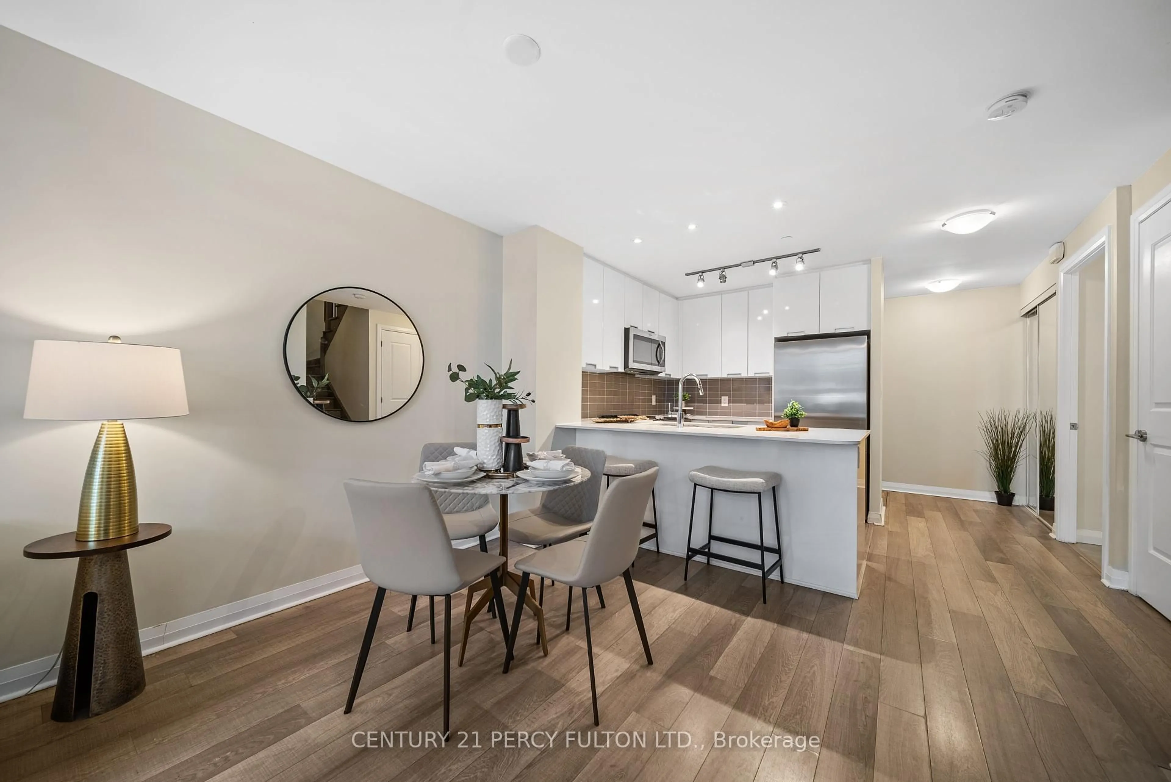 Open concept kitchen, wood/laminate floor for 5033 Four Springs Ave #119, Mississauga Ontario L5R 0G6