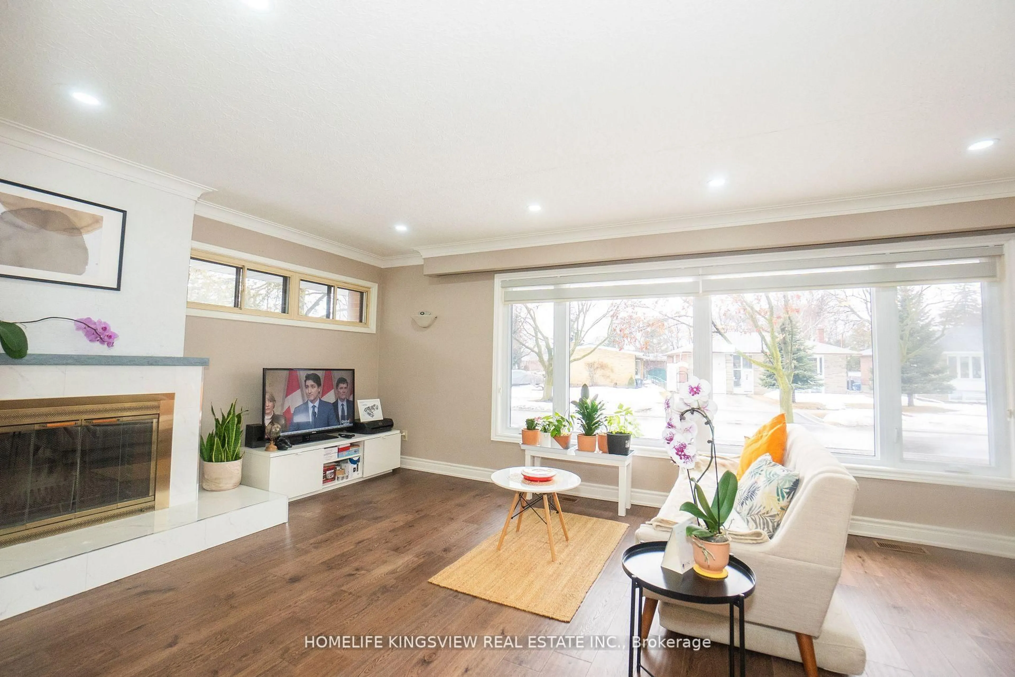Living room with furniture, wood/laminate floor for 3 Crendon Dr, Toronto Ontario M9C 3G3