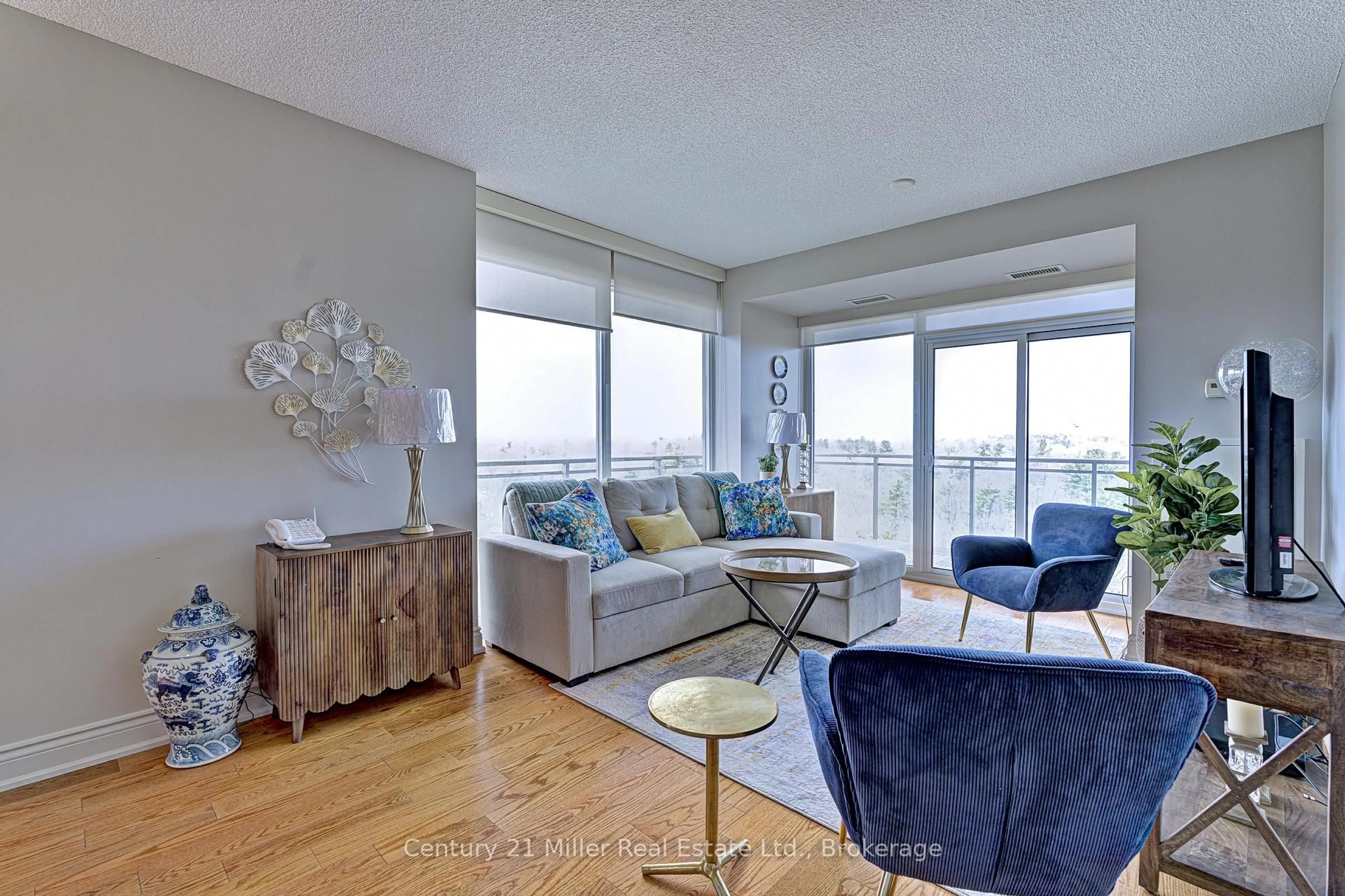 Living room with furniture, wood/laminate floor for 1665 The Collegeway #1202, Mississauga Ontario L5L 0A9