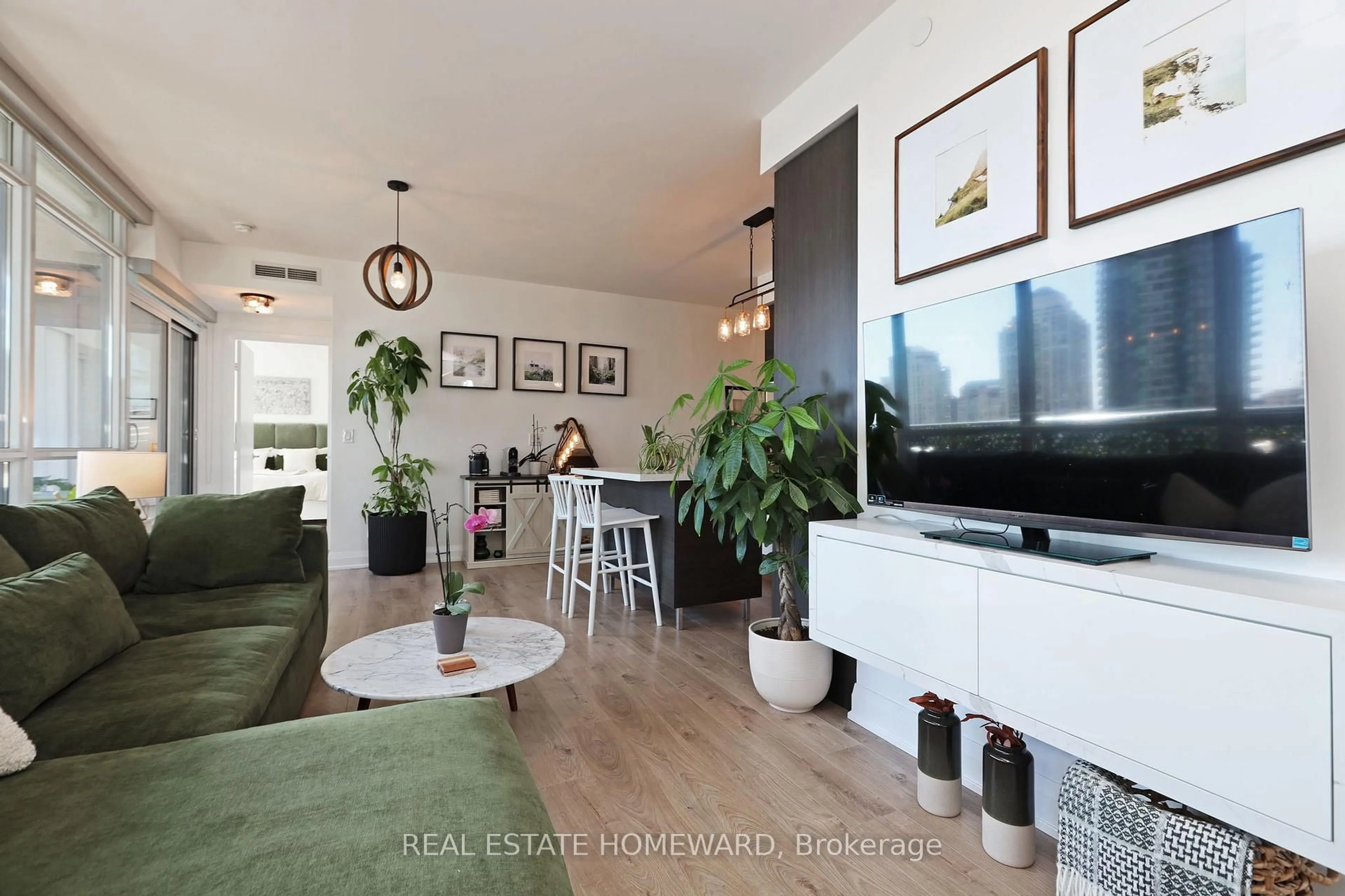 Living room with furniture, wood/laminate floor for 36 Park Lawn Ave #810, Toronto Ontario M8V 0E5