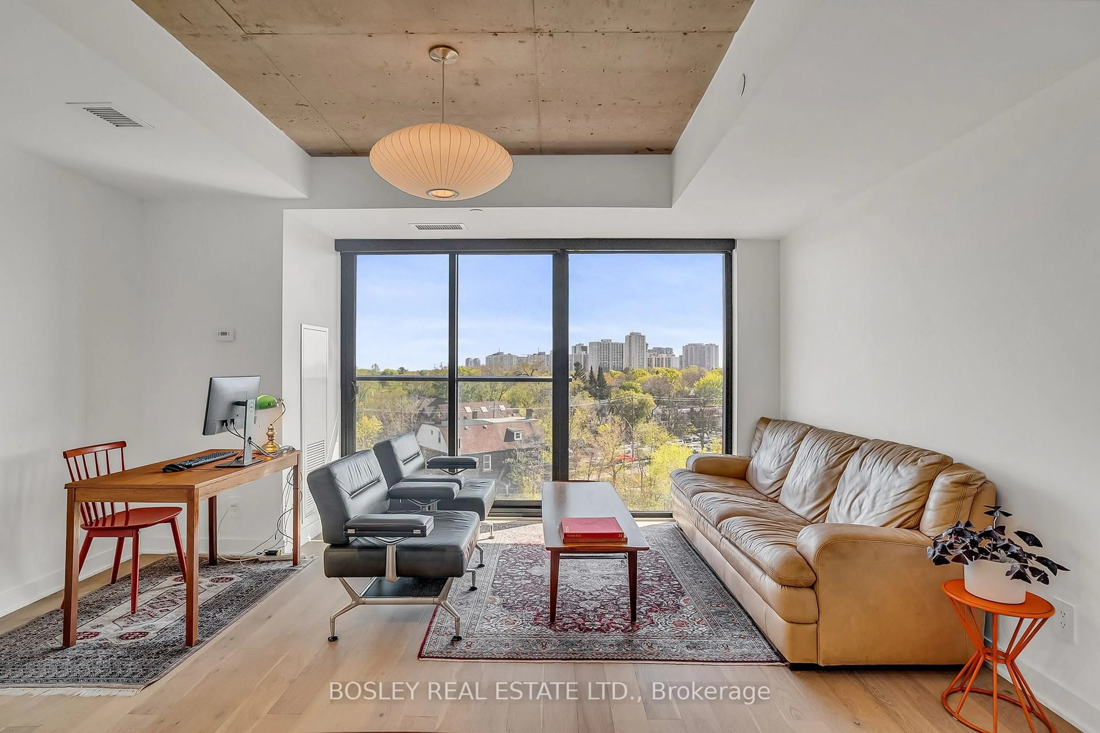 Living room with furniture, cement floor for 2720 Dundas St #522, Toronto Ontario M6P 0C3
