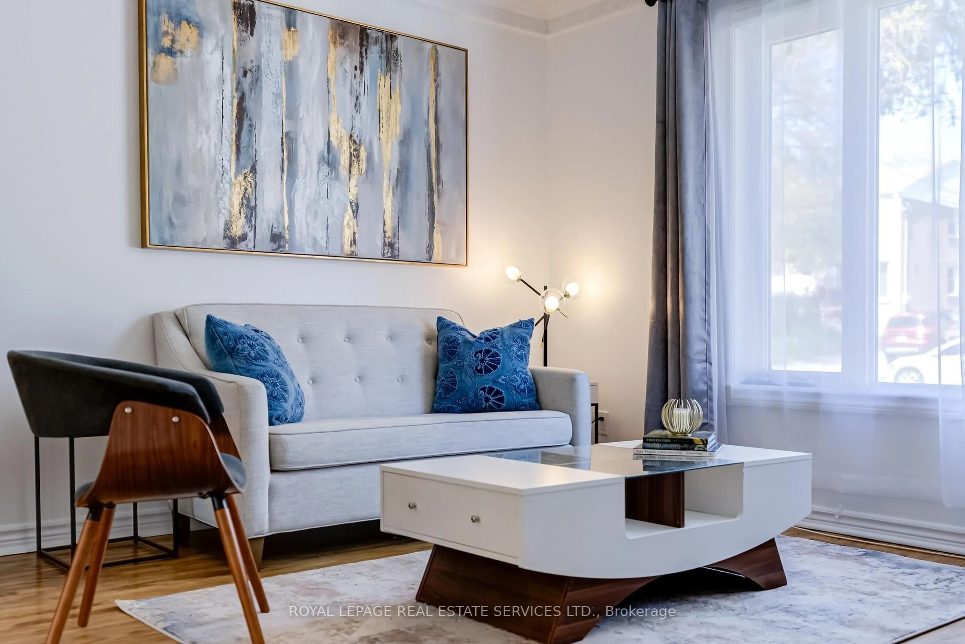 Living room with furniture, wood/laminate floor for 34 Skylark Rd, Toronto Ontario M6S 4M4
