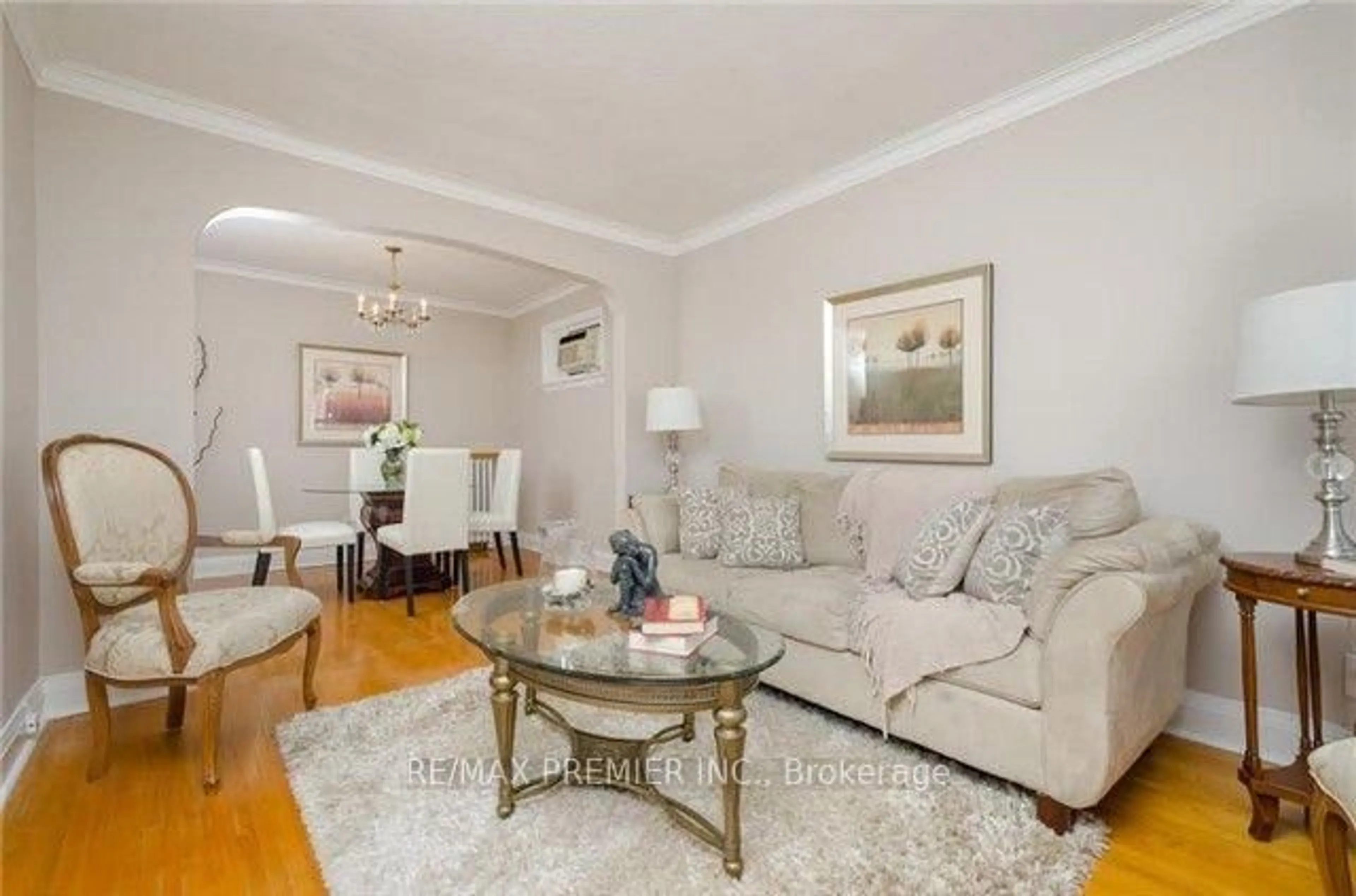 Living room with furniture, wood/laminate floor for 1013 Briar Hill Ave, Toronto Ontario M6B 1M6