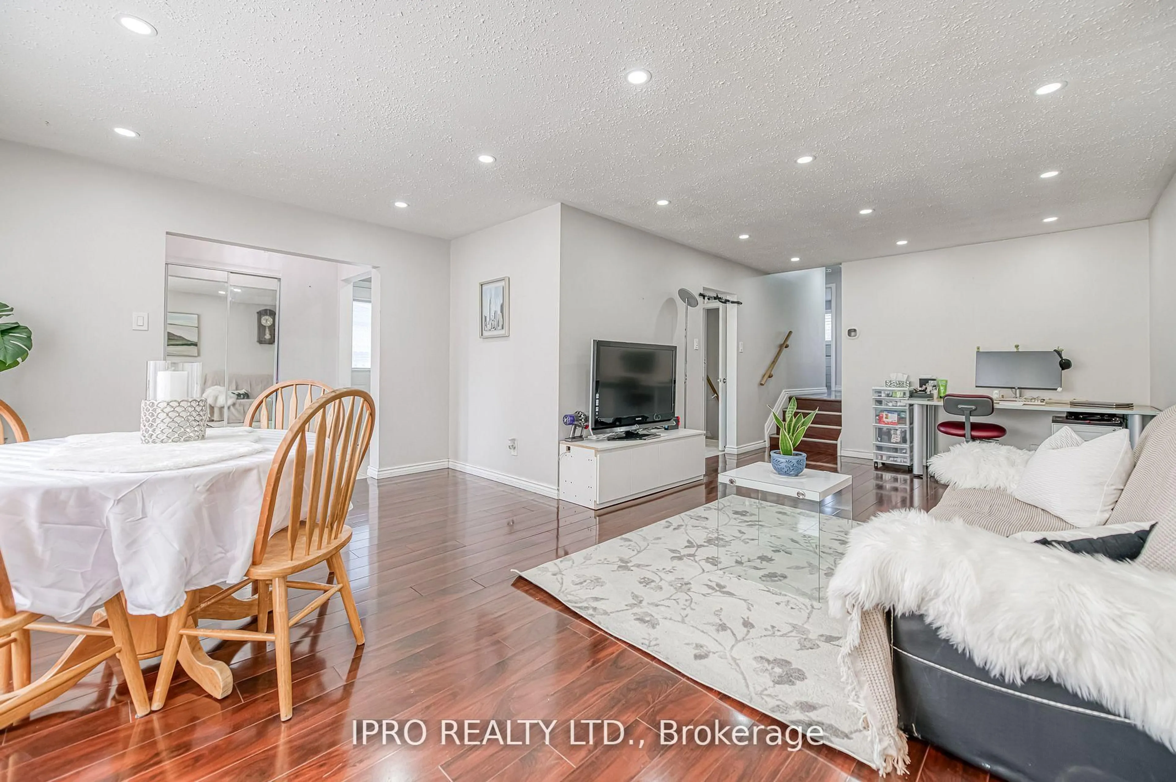 Living room with furniture, wood/laminate floor for 49 Ascot Ave, Brampton Ontario L6T 2P3