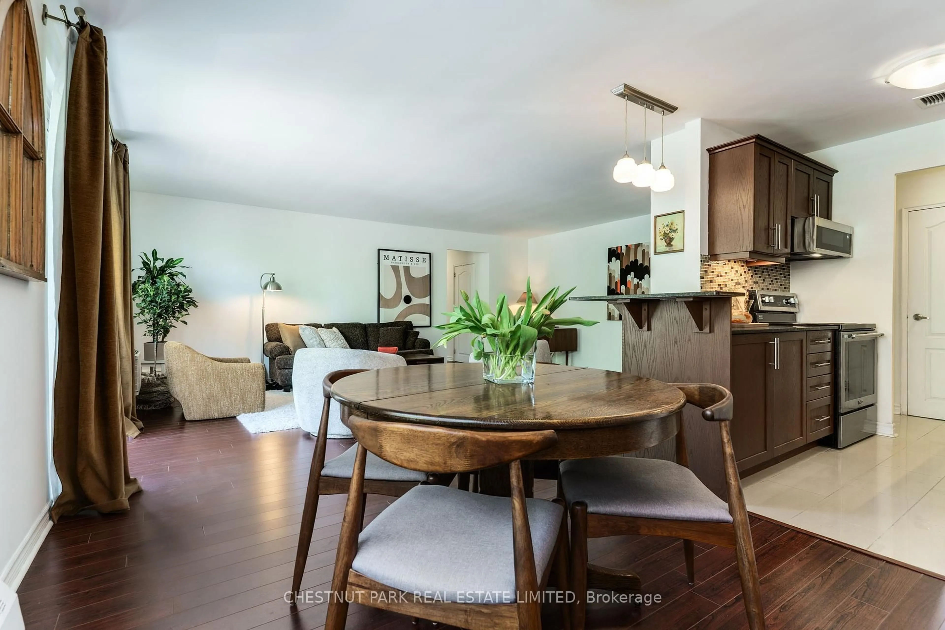 Dining room, wood/laminate floor for 60 Gulliver Rd #205, Toronto Ontario M6M 2M6