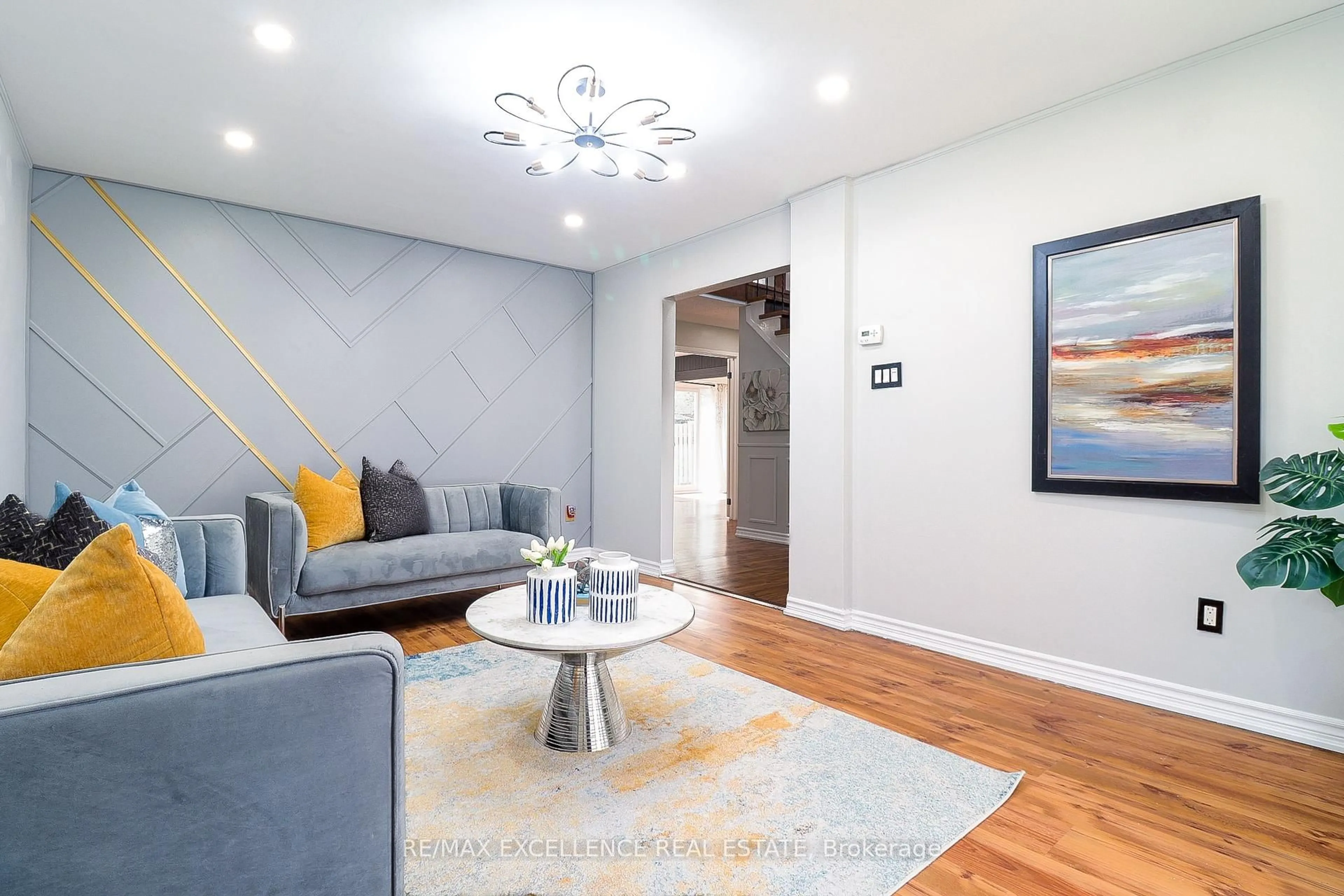 Living room with furniture, wood/laminate floor for 19 Mikado Cres, Brampton Ontario L6S 3R3