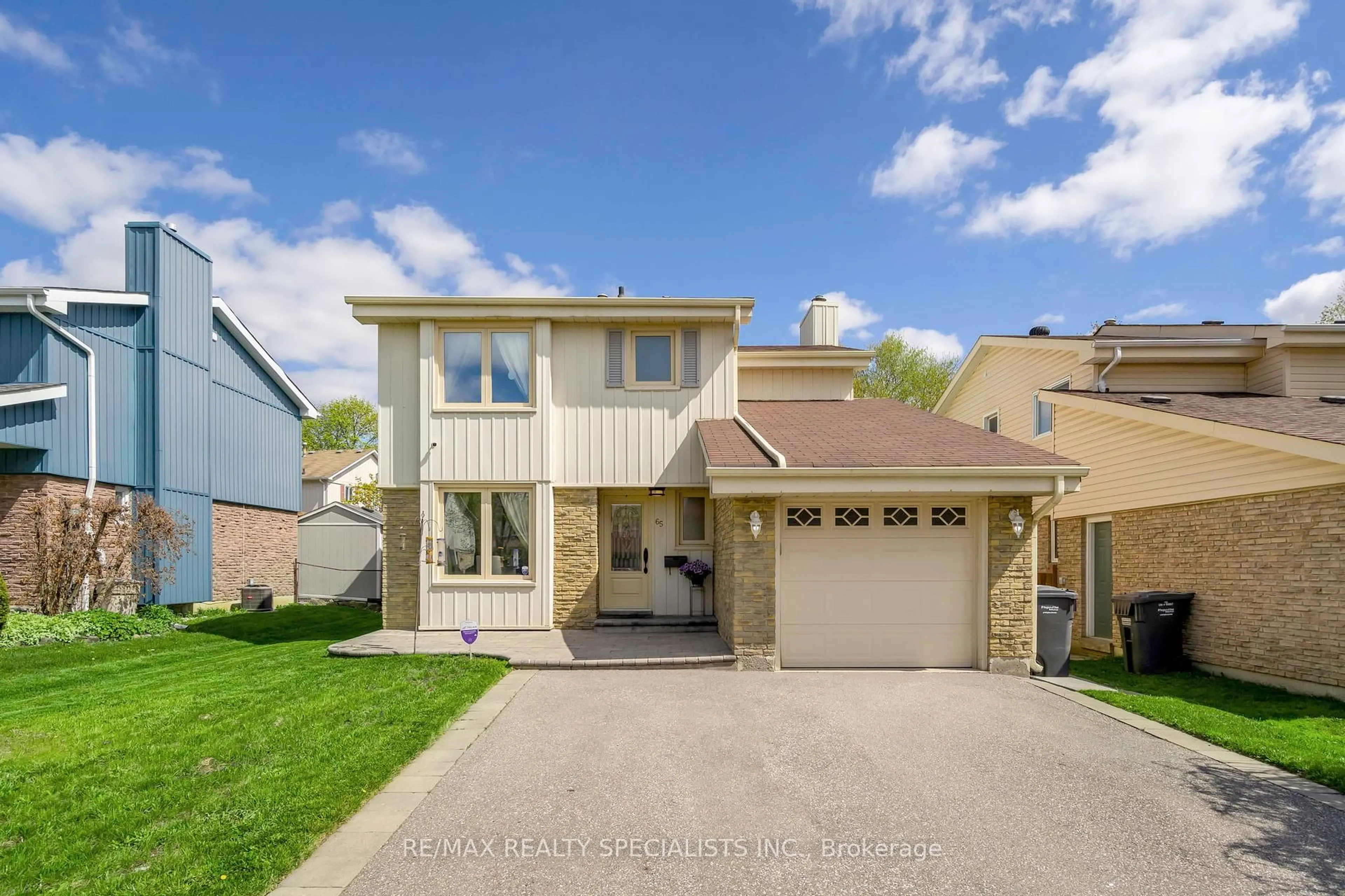 Home with vinyl exterior material, street for 65 Somerset Dr, Brampton Ontario L6Z 1C3