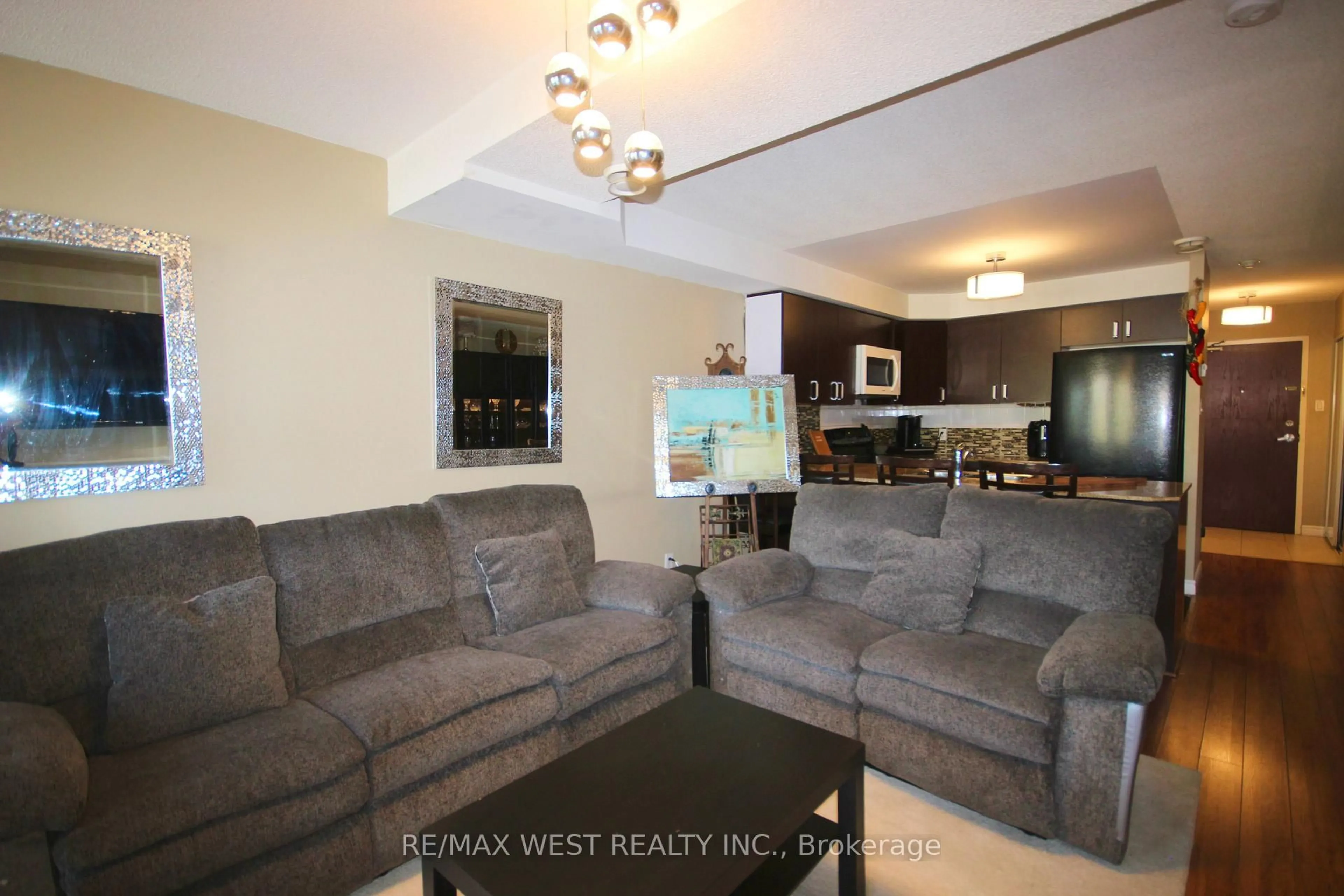 Living room with furniture, unknown for 7405 Goreway Dr #202, Mississauga Ontario L4T 0A3