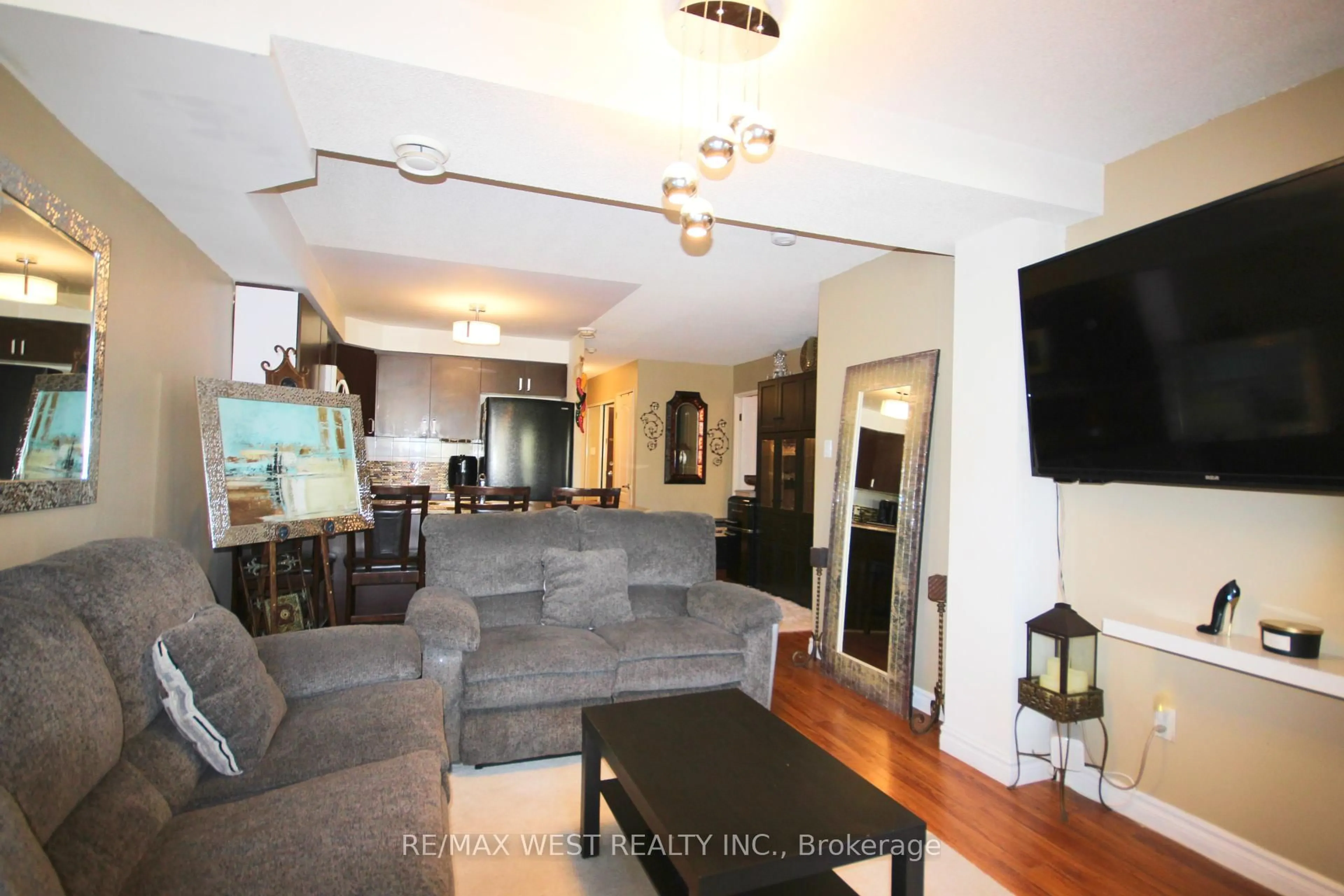 Living room with furniture, unknown for 7405 Goreway Dr #202, Mississauga Ontario L4T 0A3