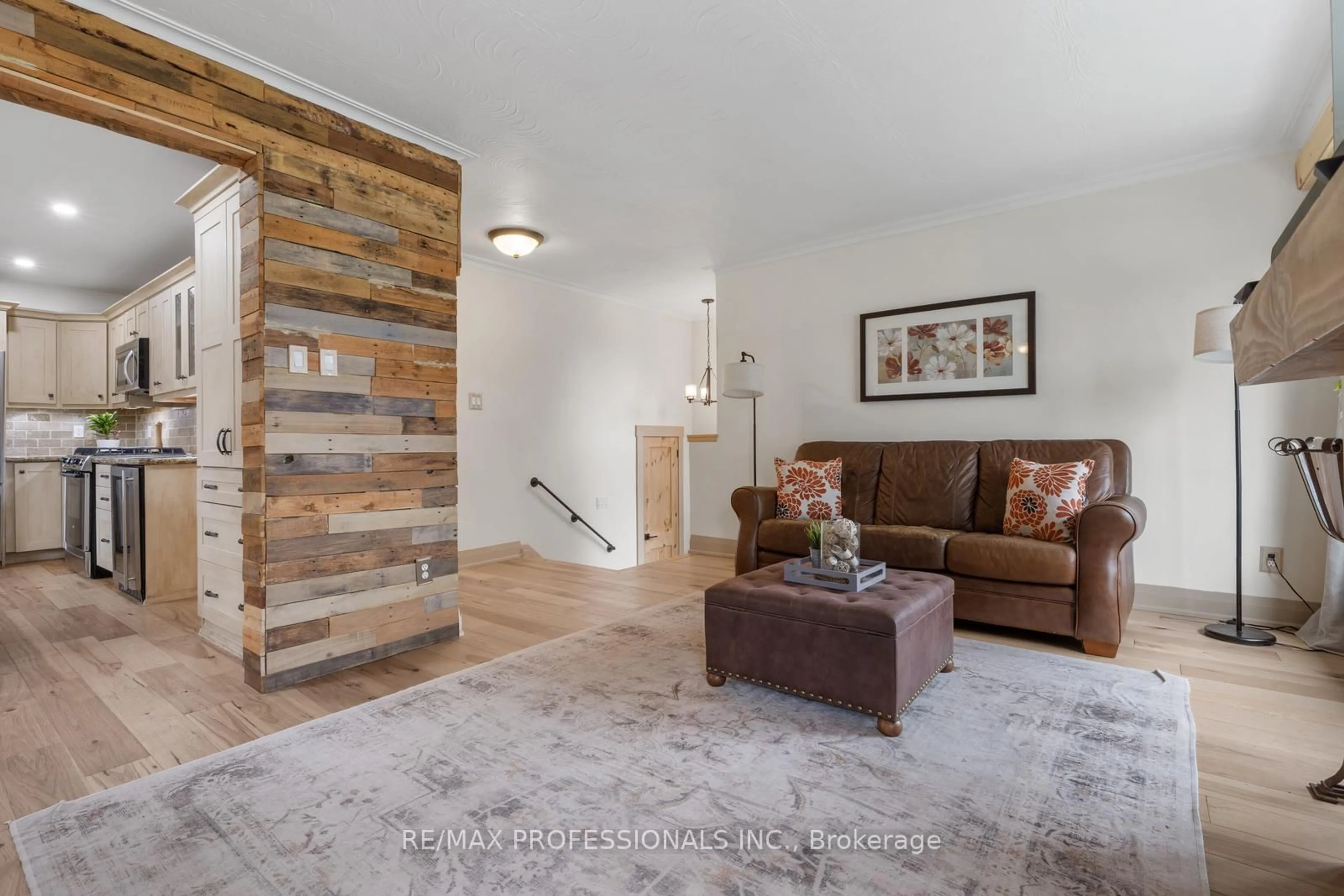 Living room with furniture, wood/laminate floor for 3 Littlewood Cres, Toronto Ontario M9C 4A9