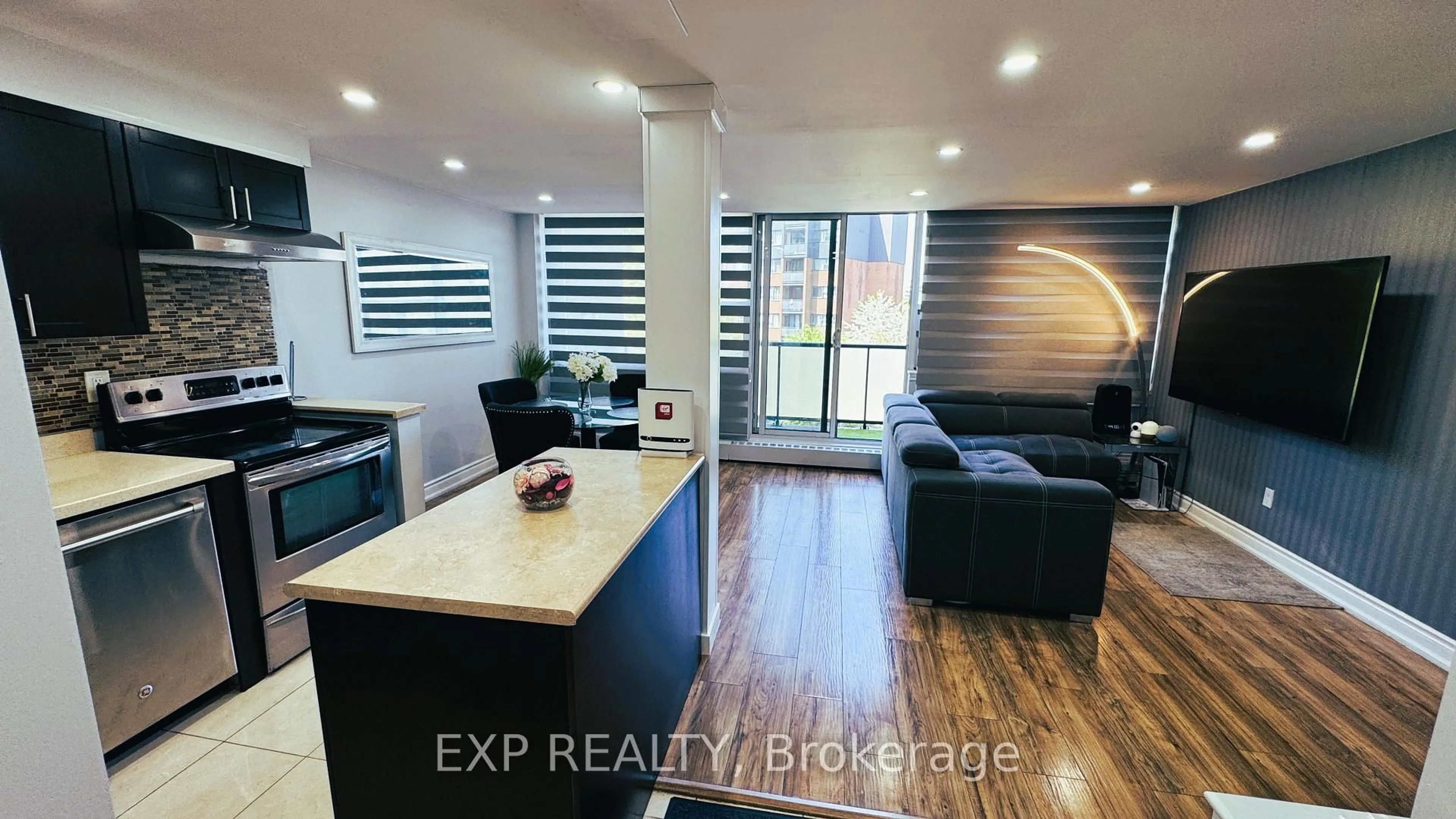 Open concept kitchen, wood/laminate floor for 2121 Roche Crt #302, Mississauga Ontario L5K 2C7