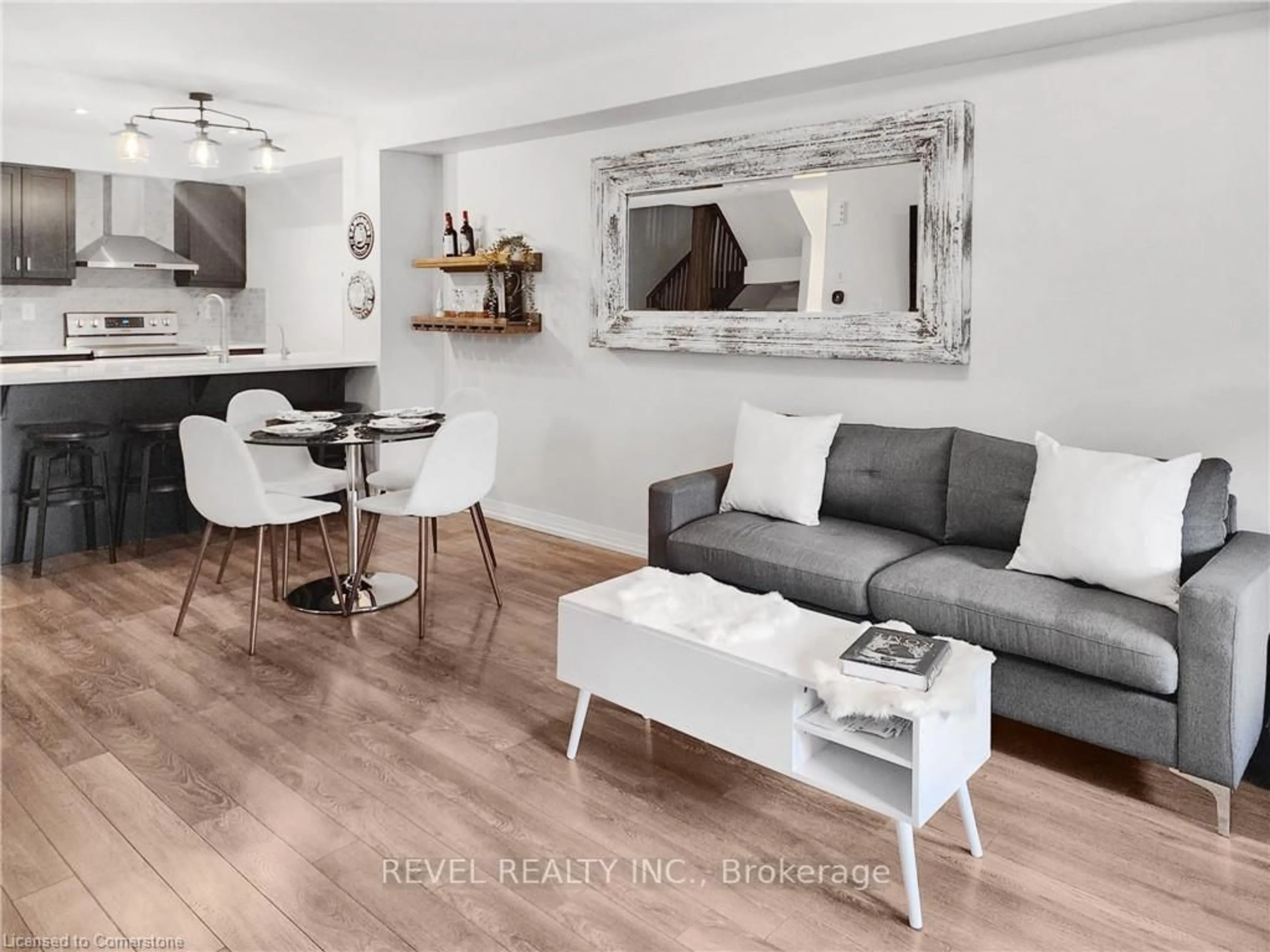 Living room with furniture, wood/laminate floor for 504 Buckeye Crt, Milton Ontario L9T 7E7