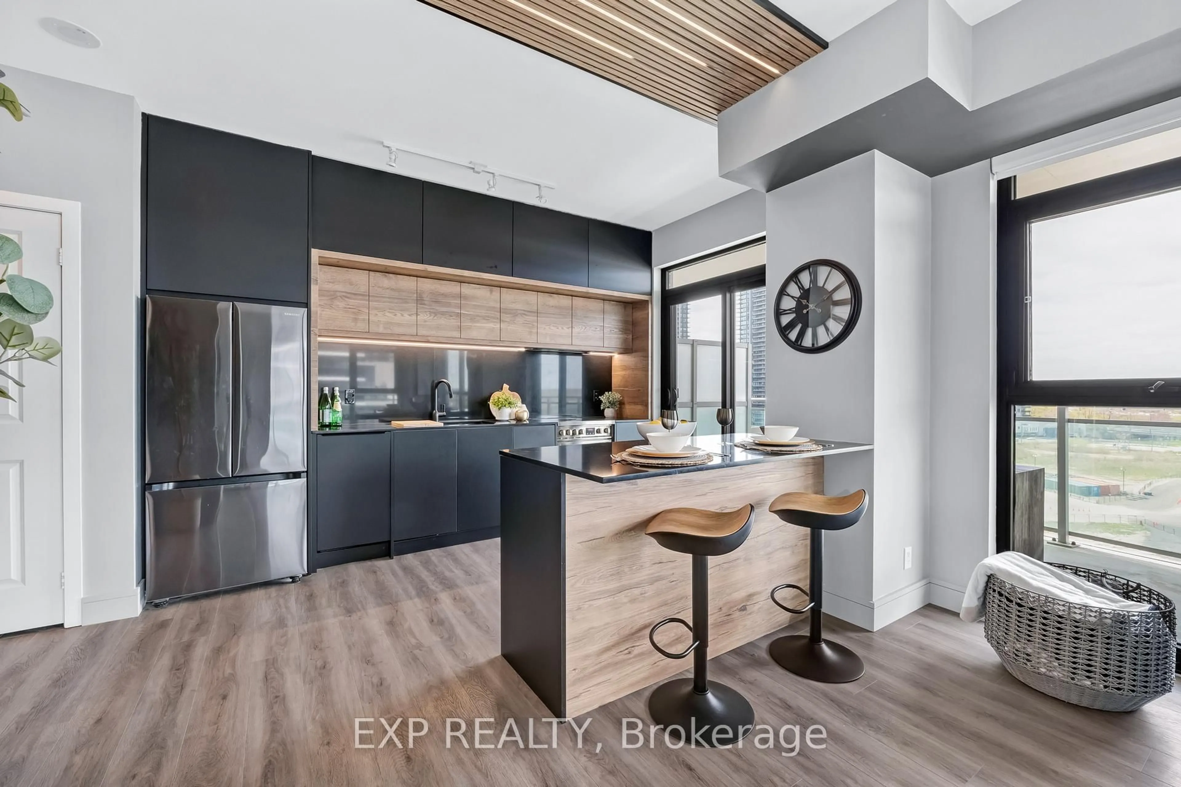 Open concept kitchen, wood/laminate floor for 33 Shore Breeze Dr #904, Toronto Ontario M8V 1A1