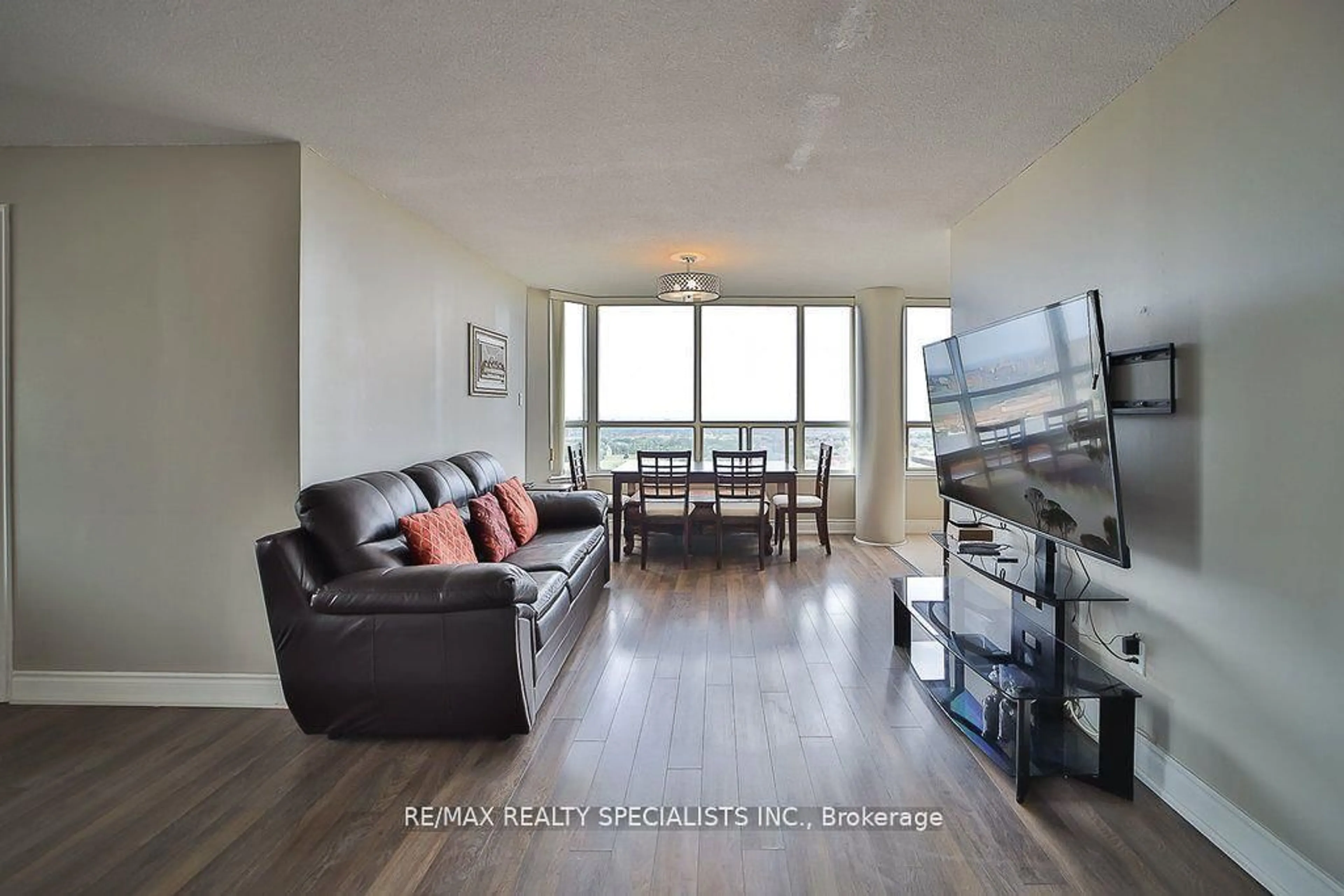 Living room with furniture, wood/laminate floor for 400 Webb Dr #2209, Mississauga Ontario L5B 3Z7