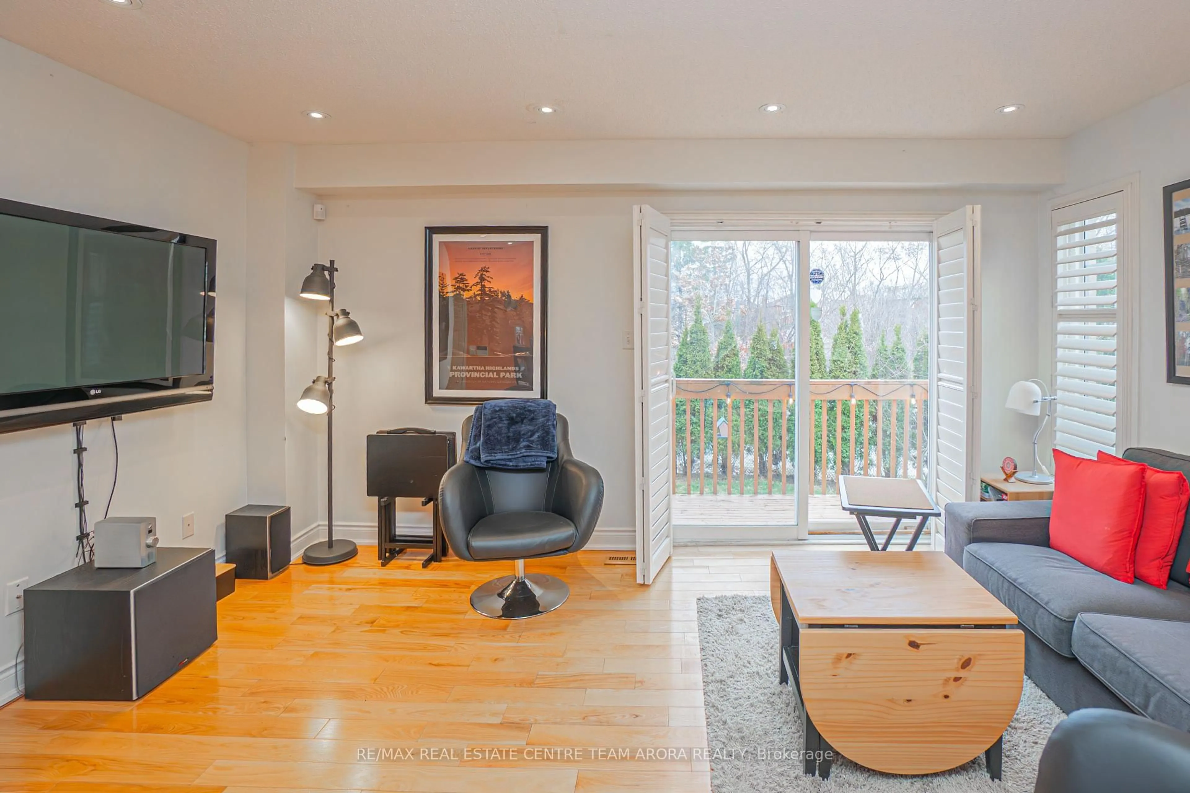 Living room with furniture, wood/laminate floor for 67 Axelrod Ave, Brampton Ontario L6Y 5S9