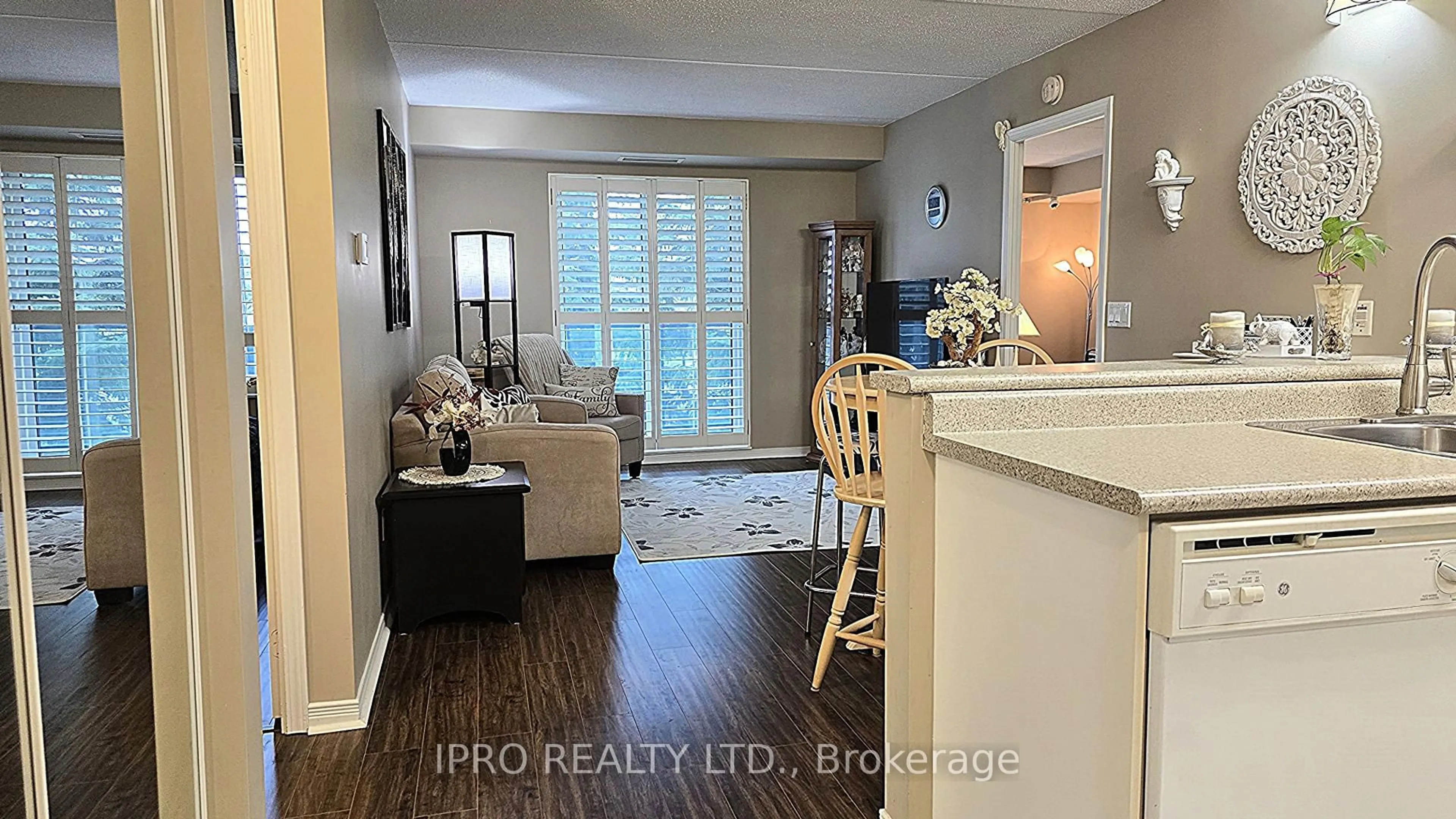 Living room with furniture, wood/laminate floor for 25 Via Rosedale Way #207, Brampton Ontario L6R 3J8