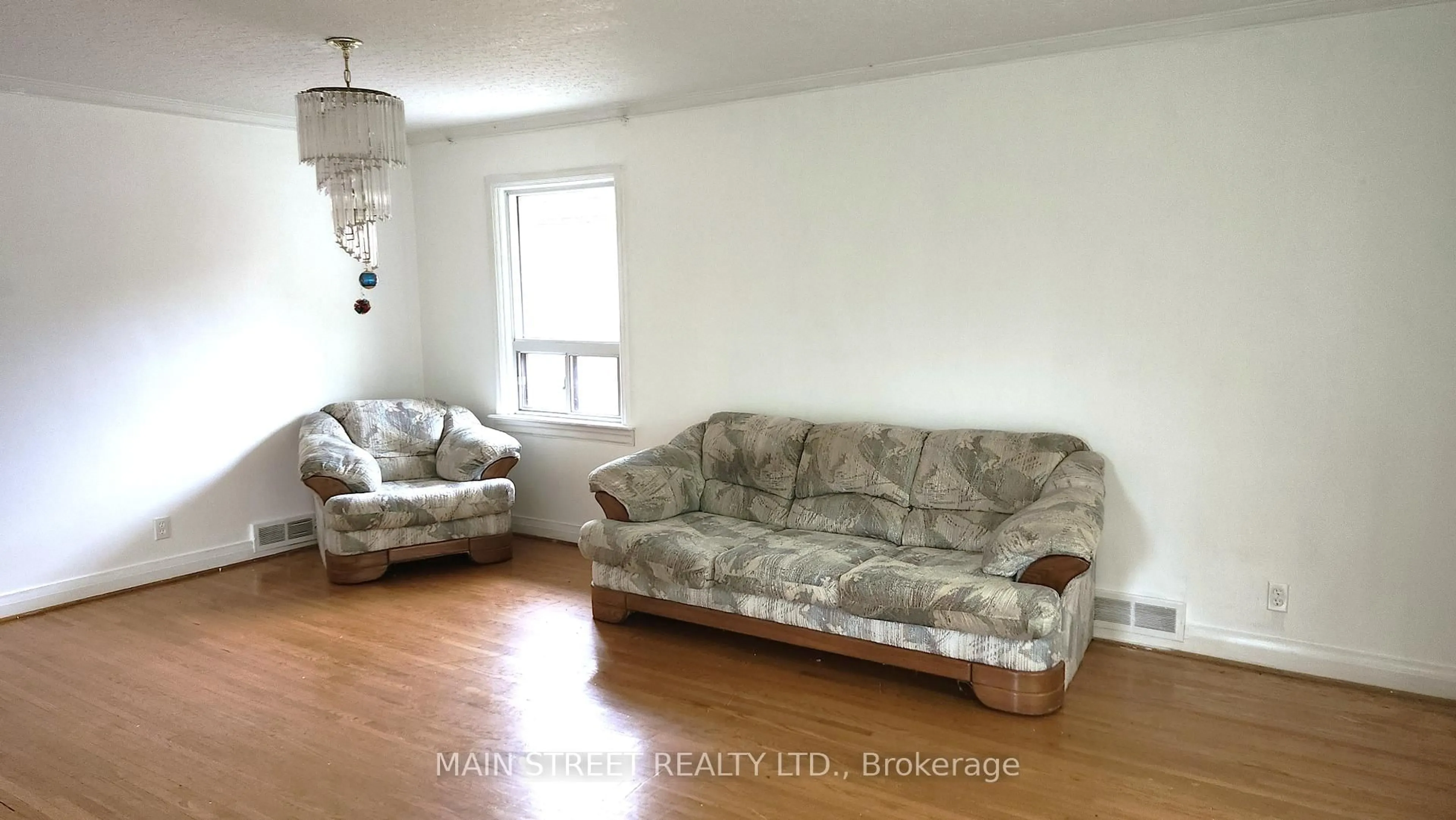 Living room with furniture, wood/laminate floor for 37 Fairlin Dr, Toronto Ontario M9B 4J4