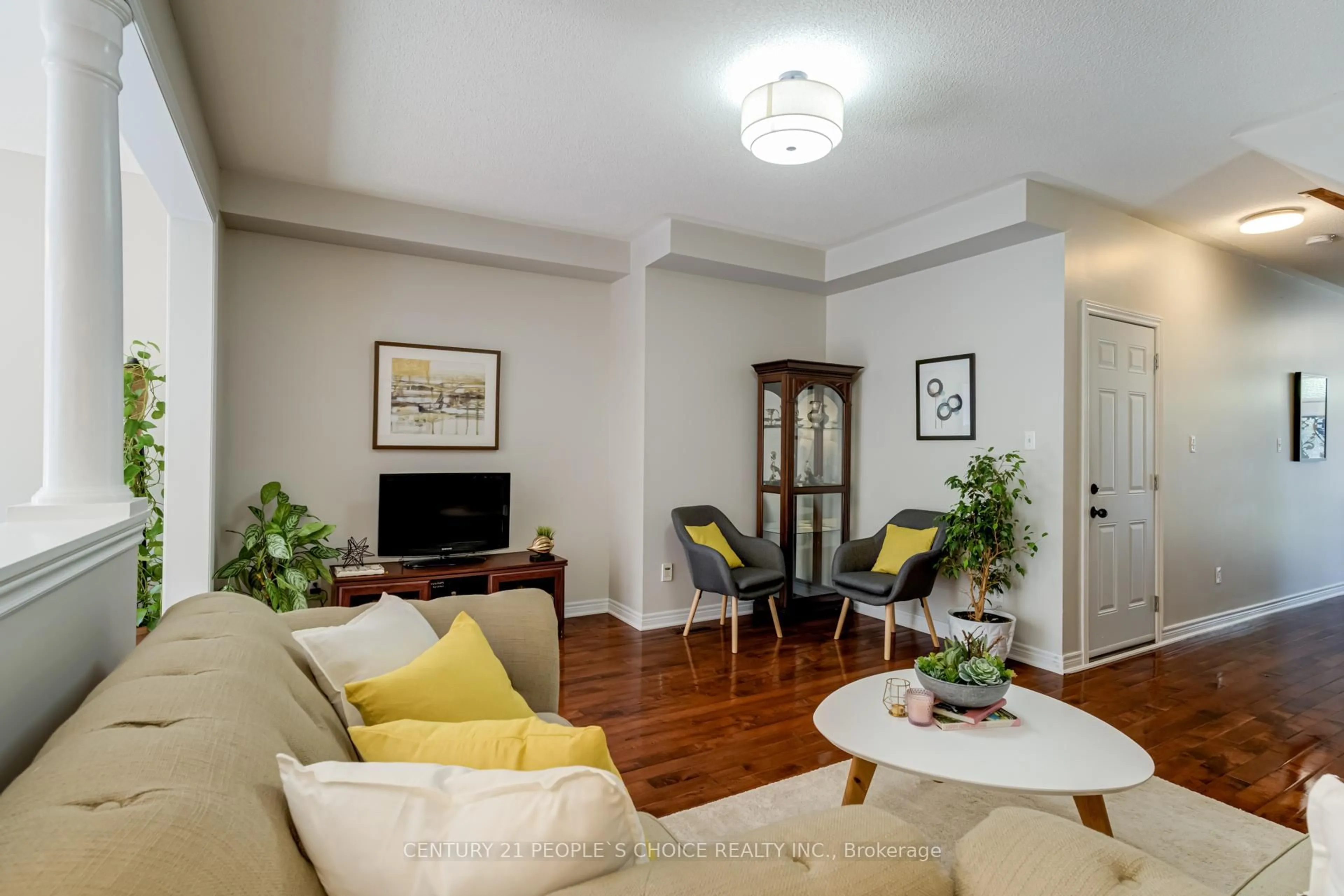 Living room with furniture, wood/laminate floor for 9 Saint Eugene St, Brampton Ontario L6Y 0N5