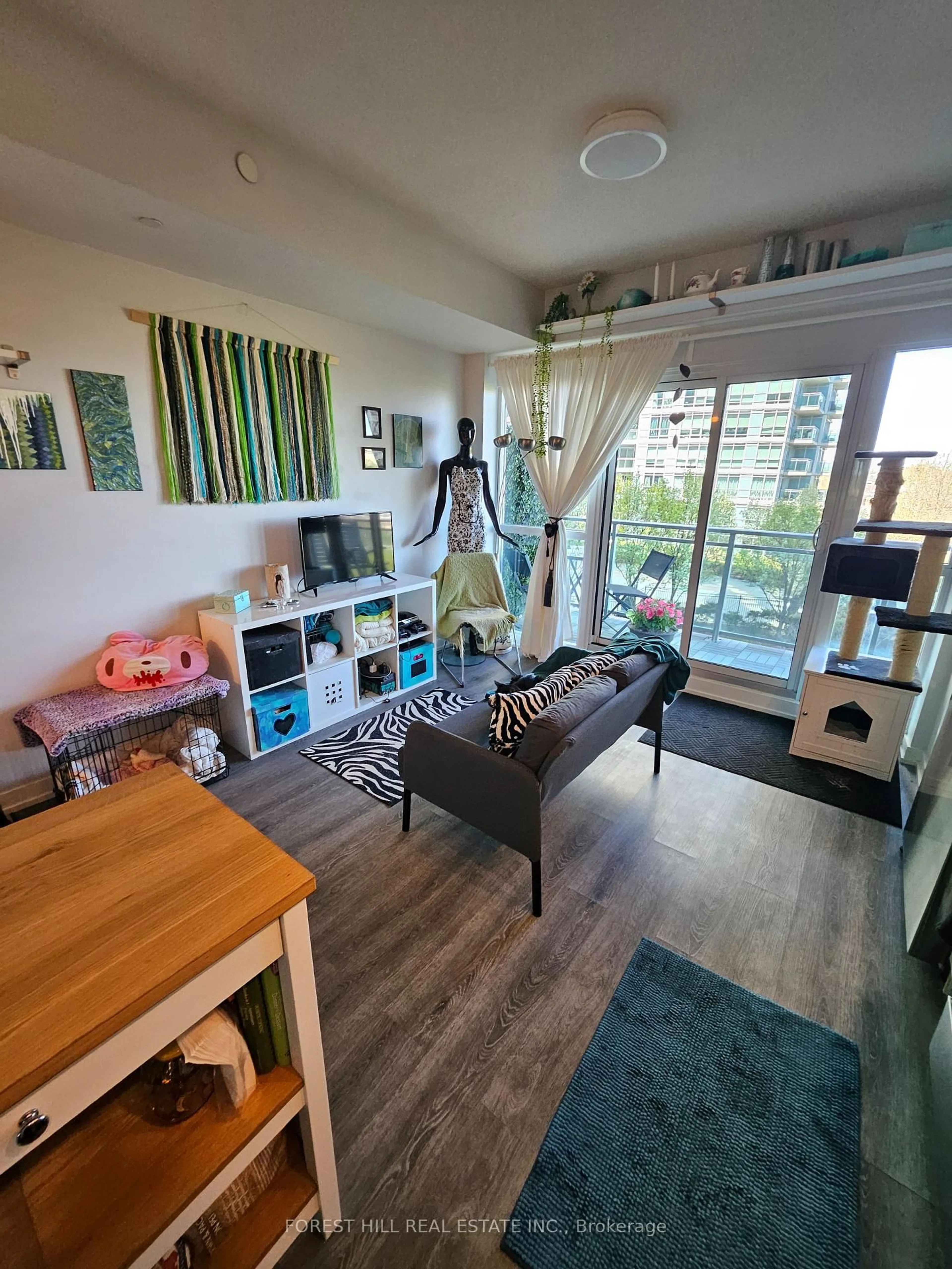 Living room with furniture, wood/laminate floor for 165 Legion Rd #623, Toronto Ontario M8Y 0B3