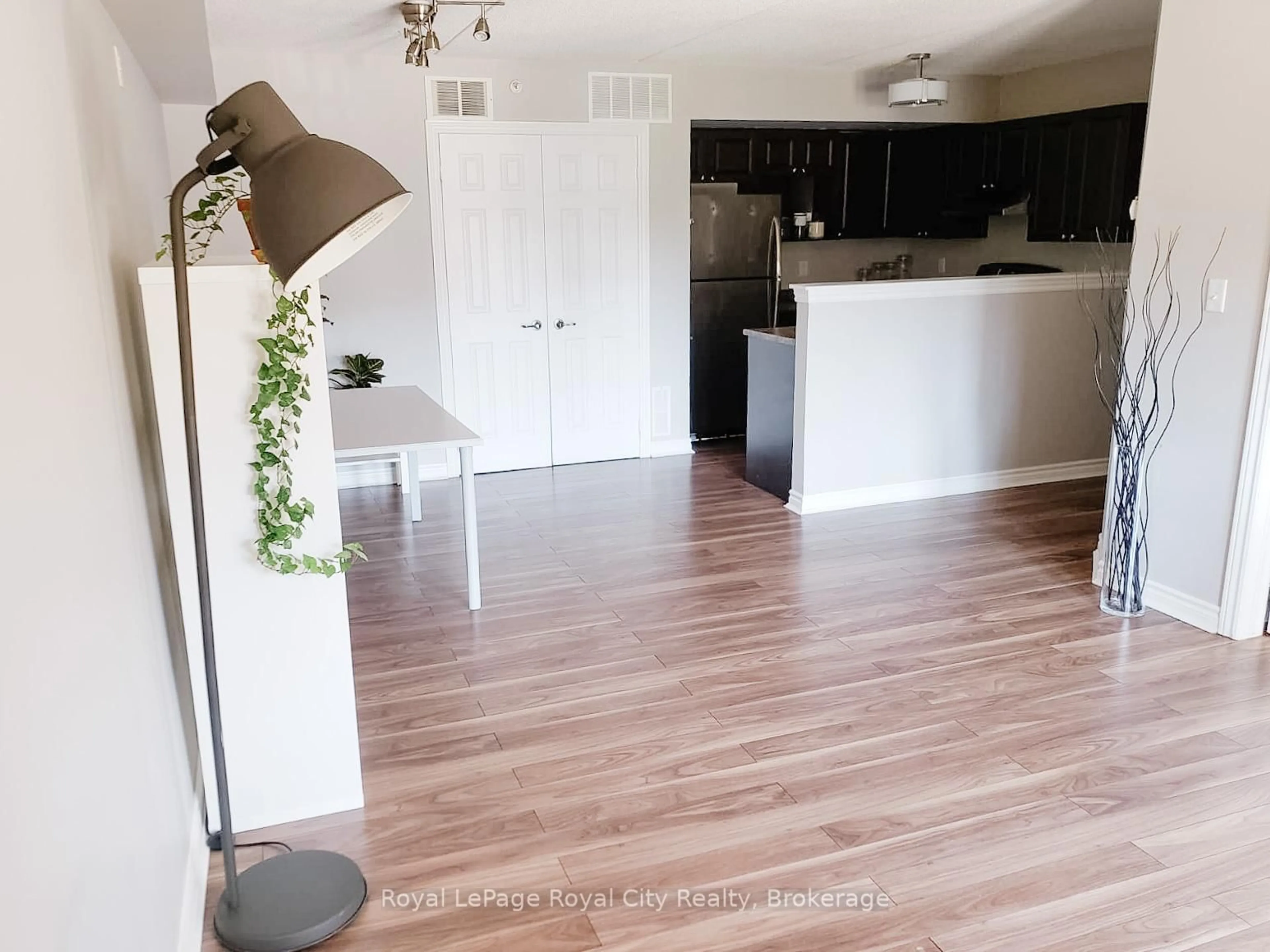 Open concept kitchen, wood/laminate floor for 1483 Maple Ave #204, Milton Ontario L9T 0B6