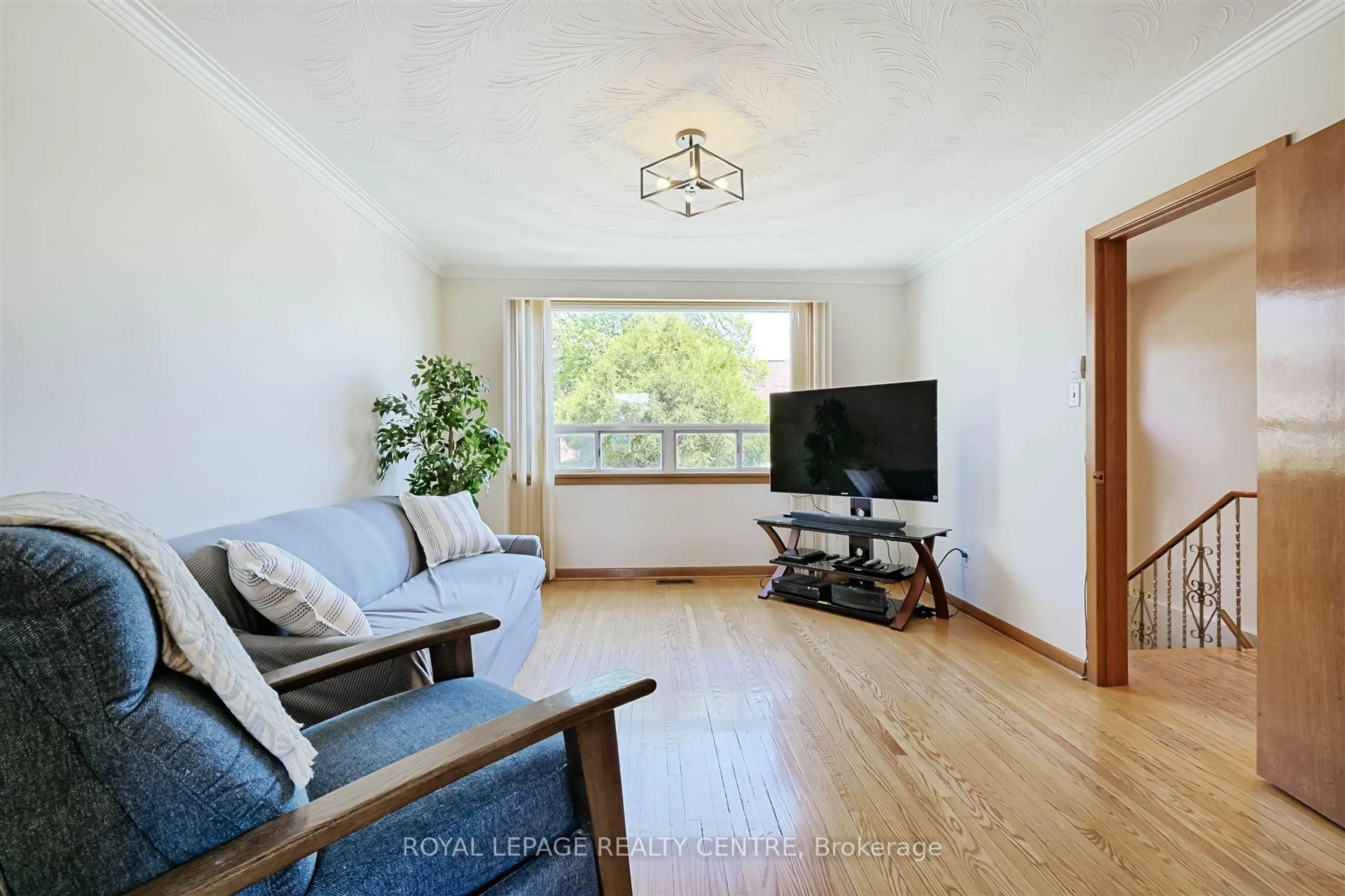 Living room with furniture, wood/laminate floor for 852 Ossington Ave, Toronto Ontario M6G 3V1