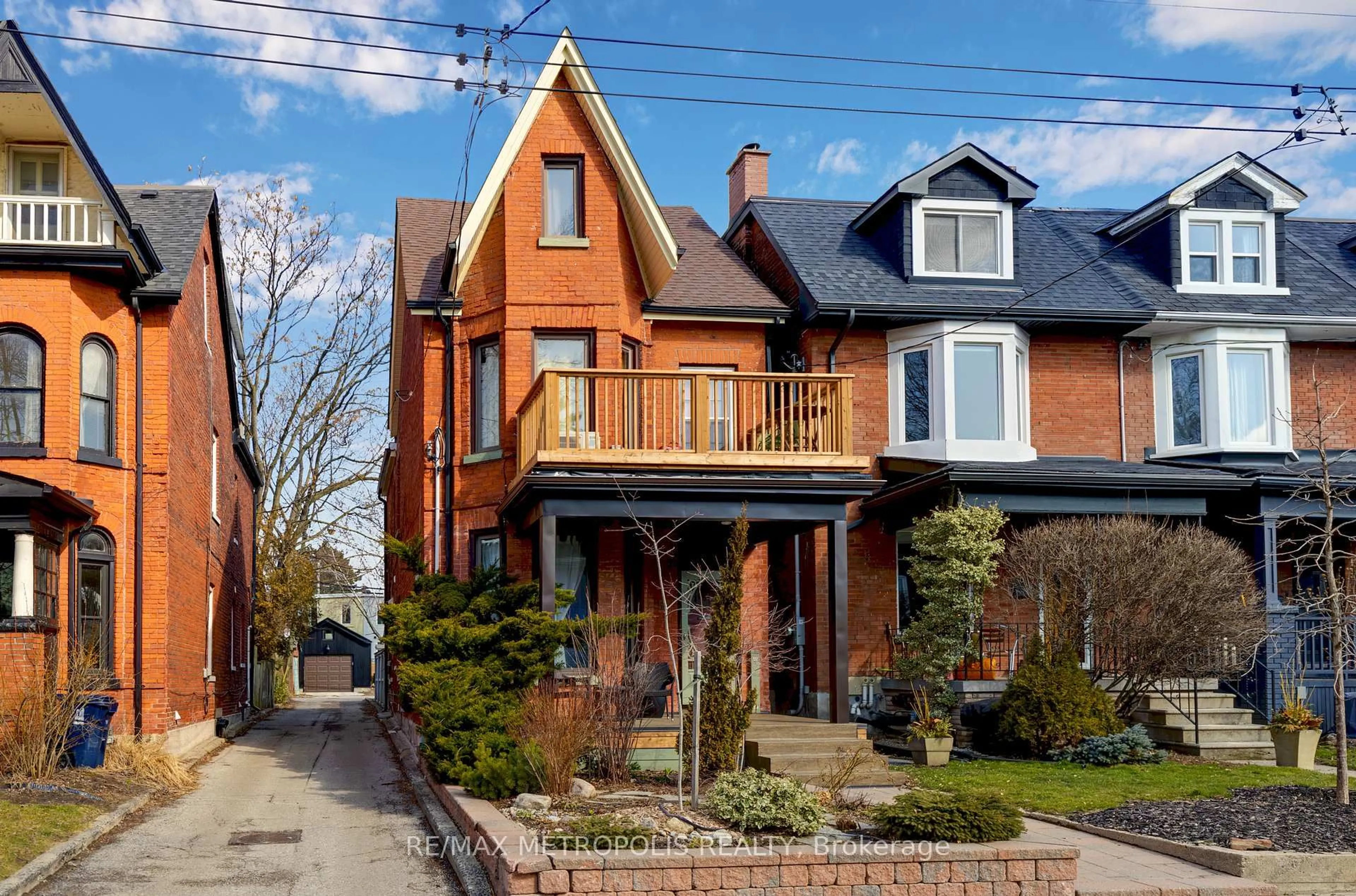 Home with brick exterior material, street for 52 Fern Ave, Toronto Ontario M6R 1K1
