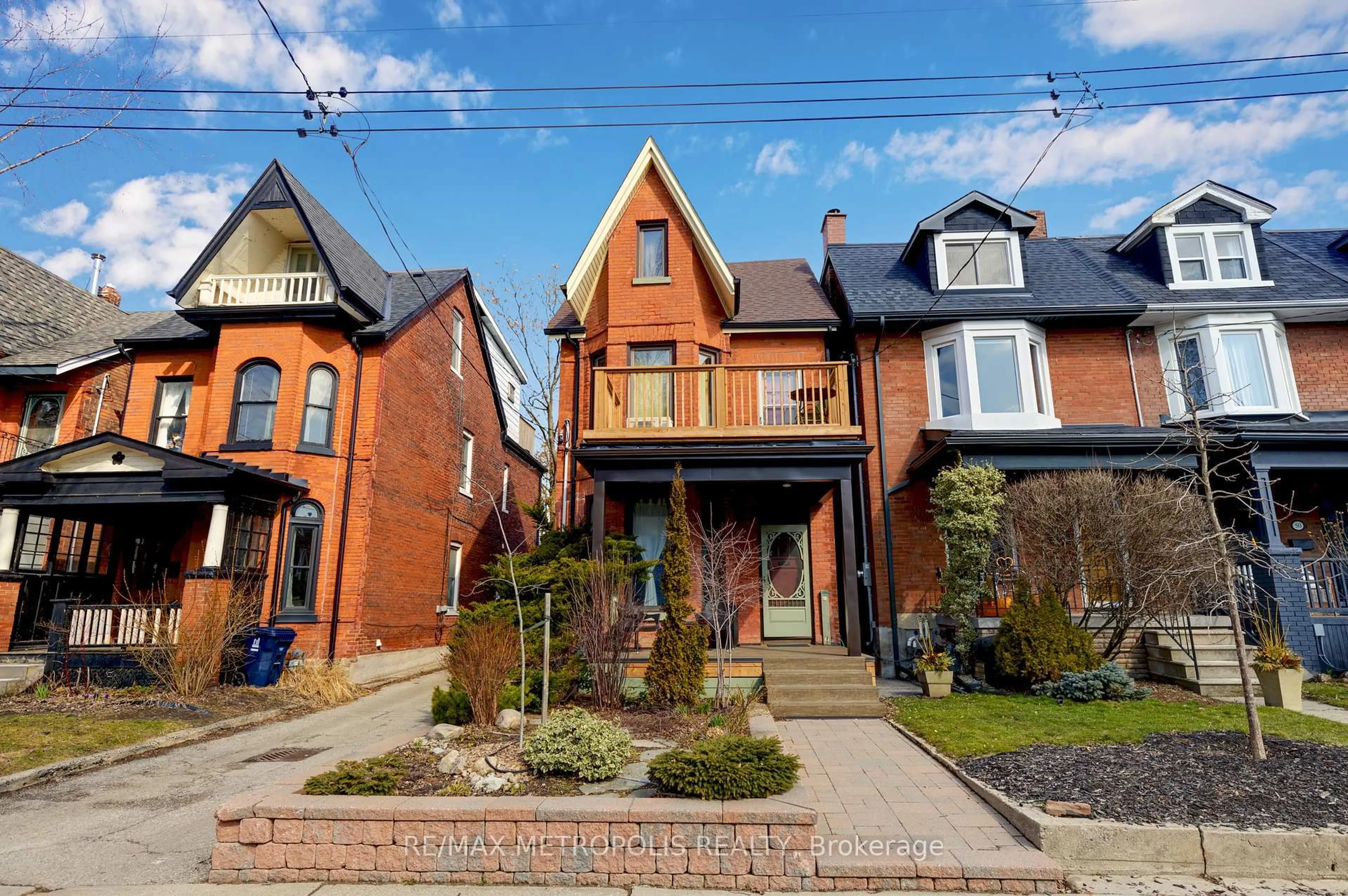 Home with brick exterior material, street for 52 Fern Ave, Toronto Ontario M6R 1K1