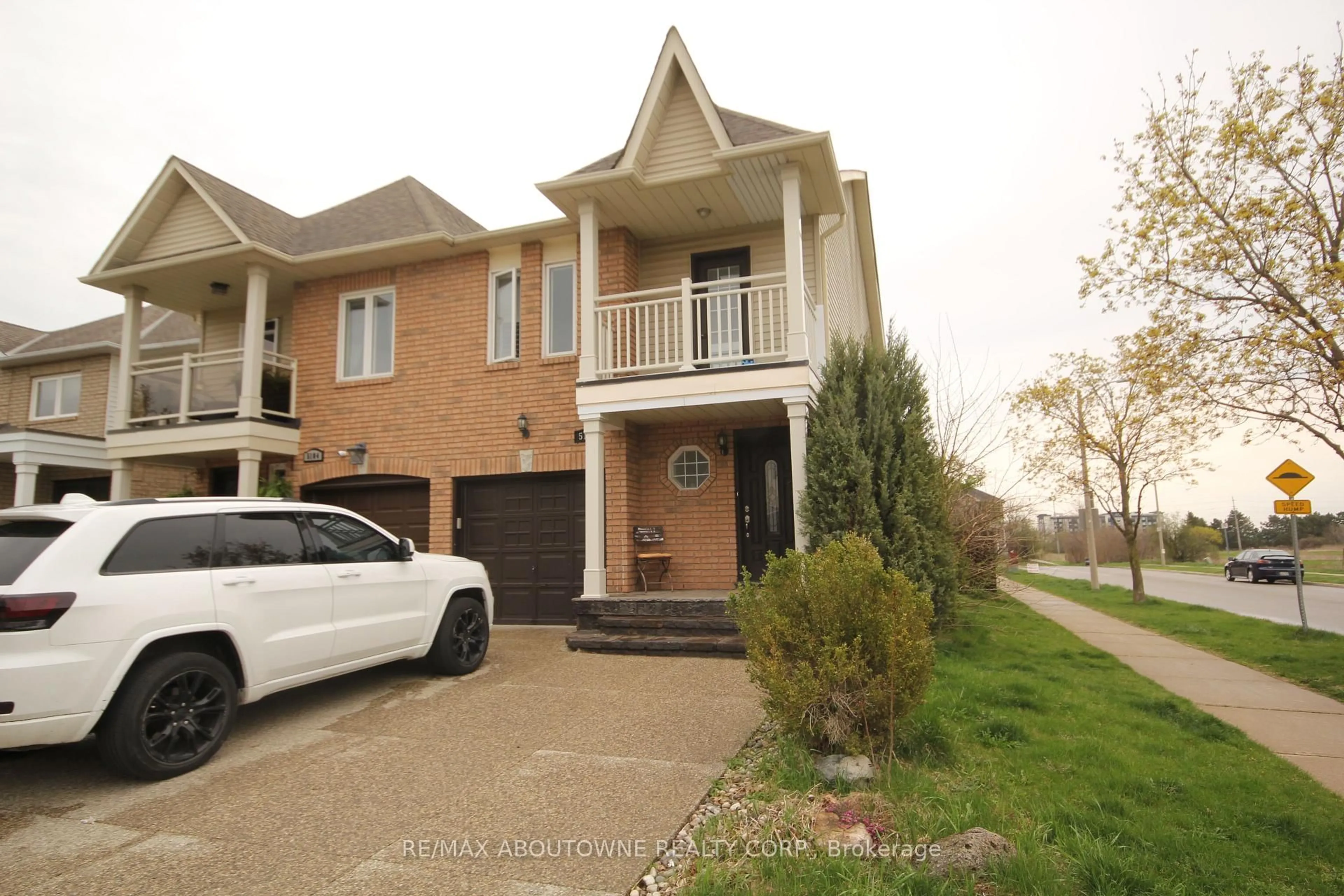 Home with brick exterior material, street for 5102 Thornburn Dr, Burlington Ontario L7L 6K2