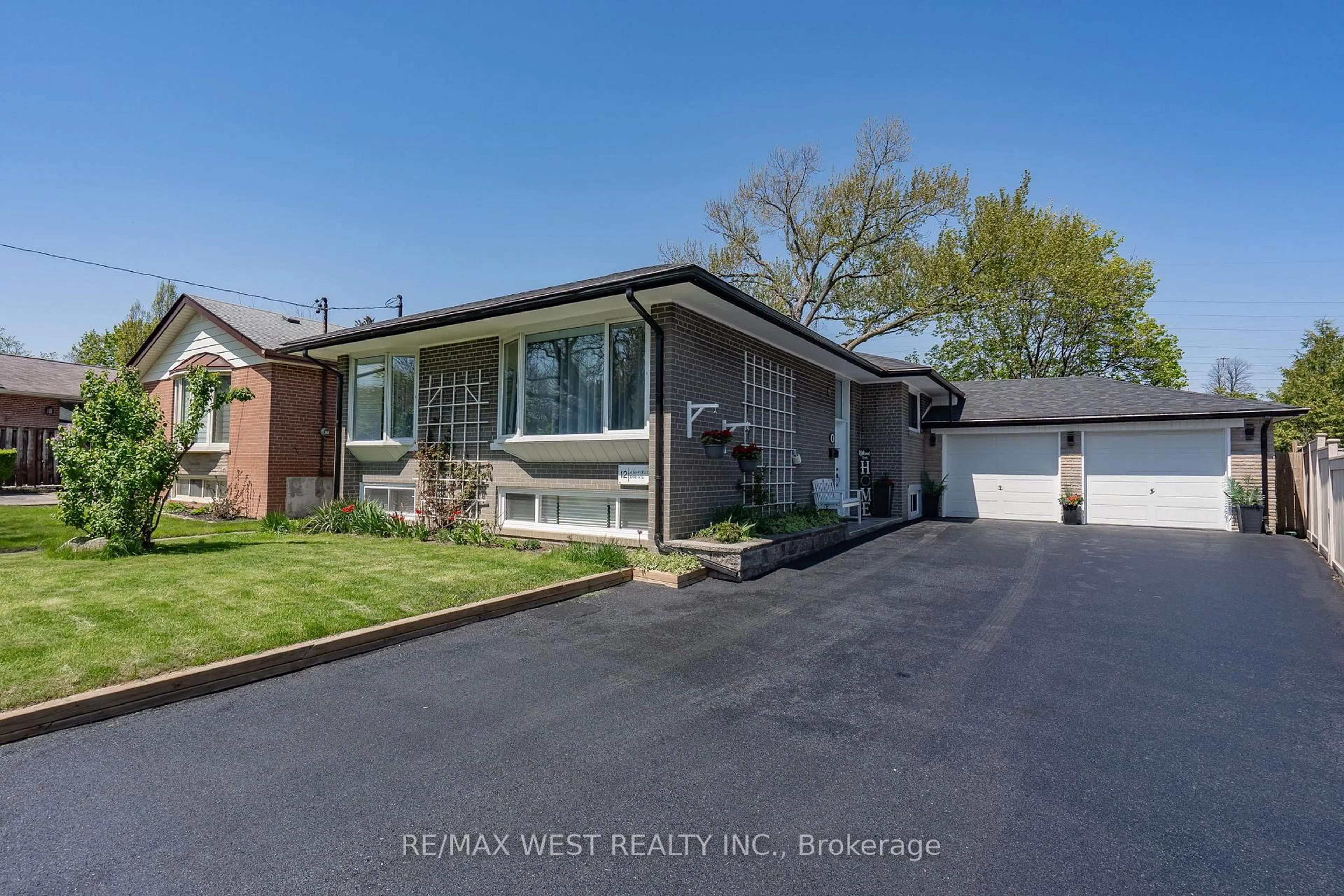 Home with brick exterior material, street for 12 Ashfield Dr, Toronto Ontario M9C 4T6