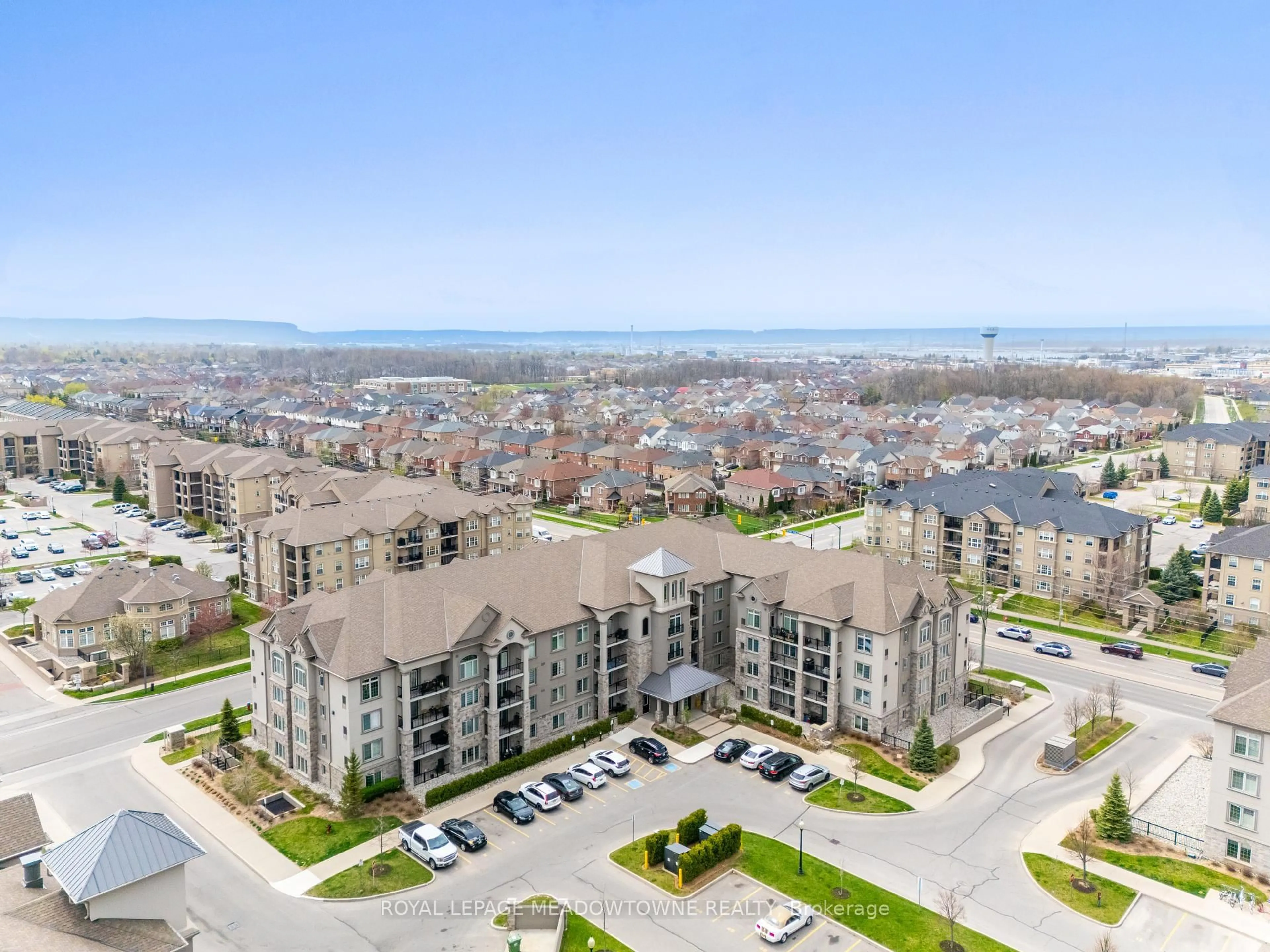 A pic from outside/outdoor area/front of a property/back of a property/a pic from drone, water/lake/river/ocean view for 1440 Main St #415, Milton Ontario L9T 8W3
