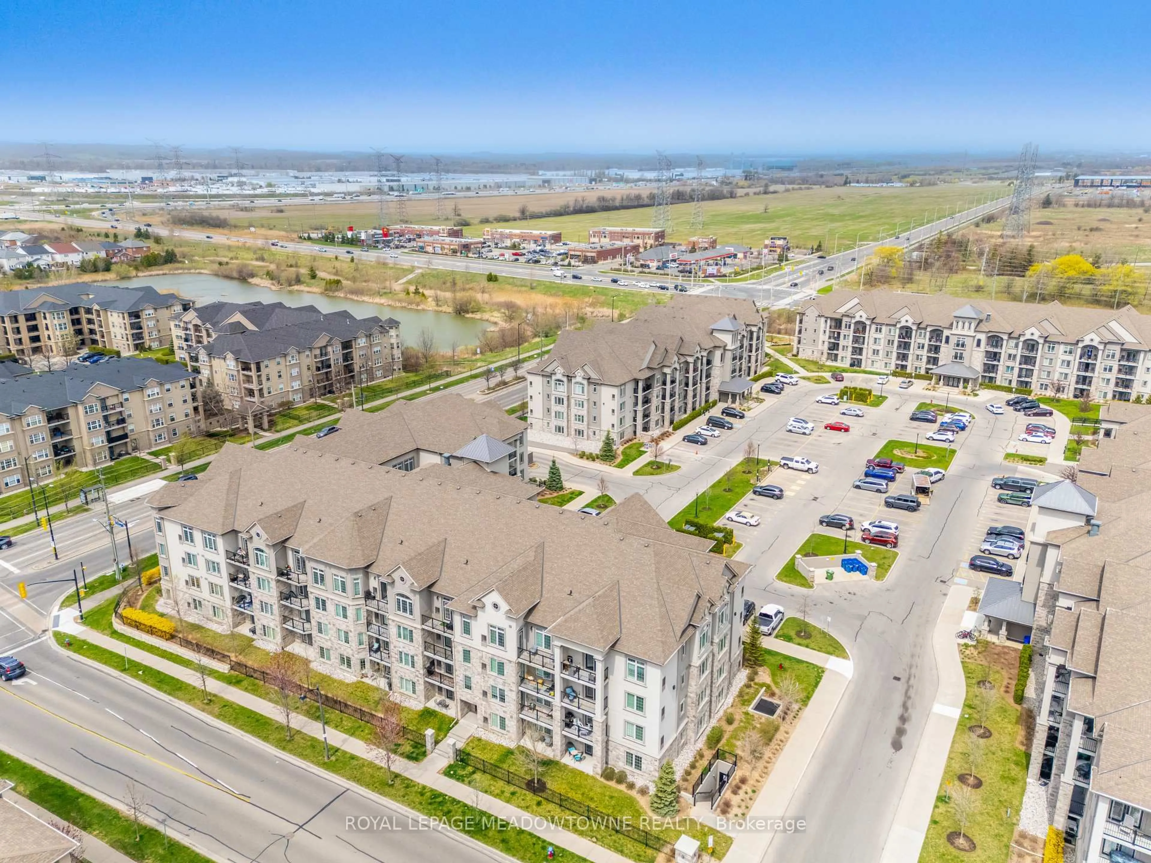 A pic from outside/outdoor area/front of a property/back of a property/a pic from drone, water/lake/river/ocean view for 1440 Main St #415, Milton Ontario L9T 8W3
