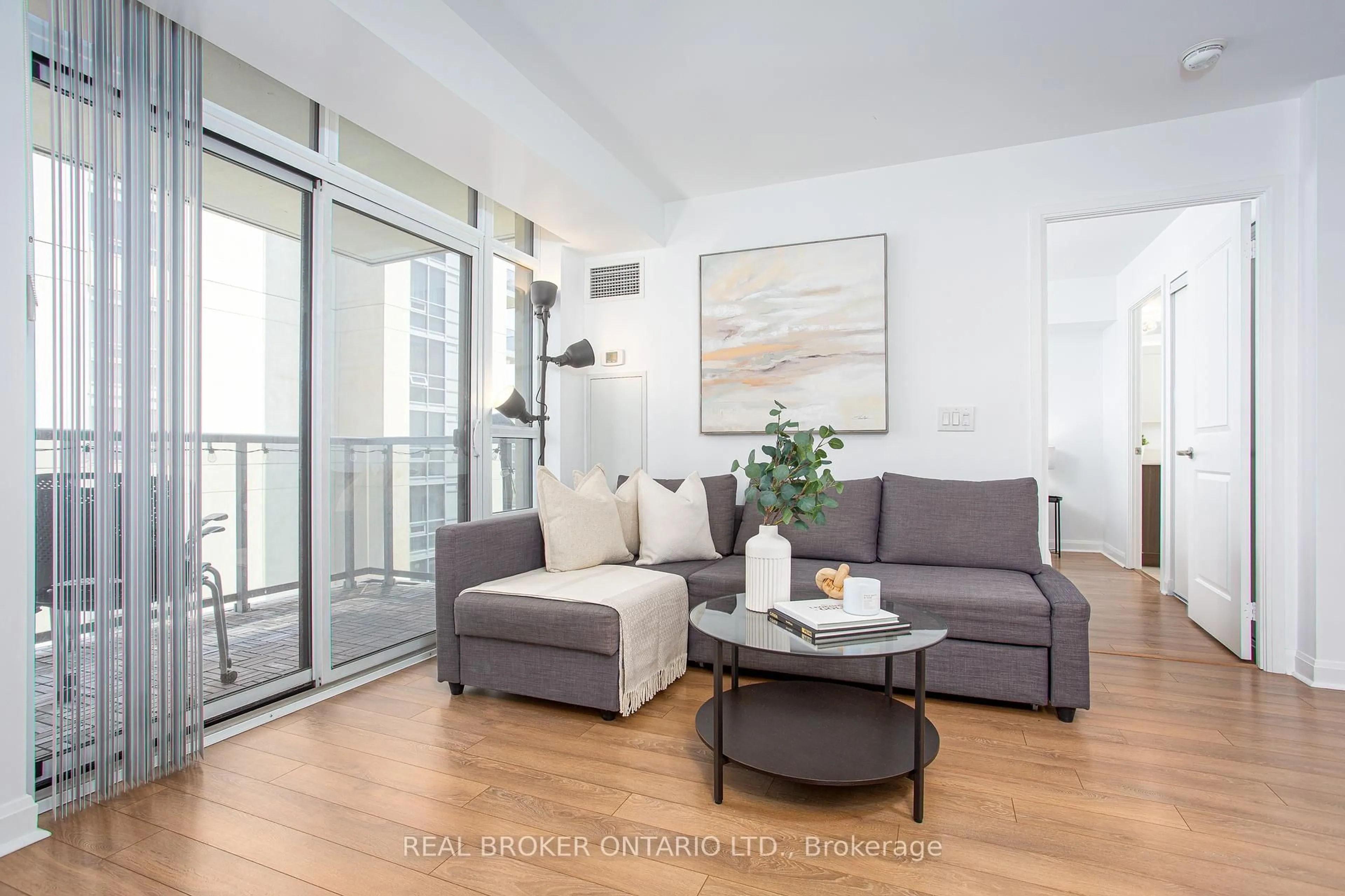 Living room with furniture, wood/laminate floor for 1 Michael Power Pl #1603, Toronto Ontario M9A 0A1