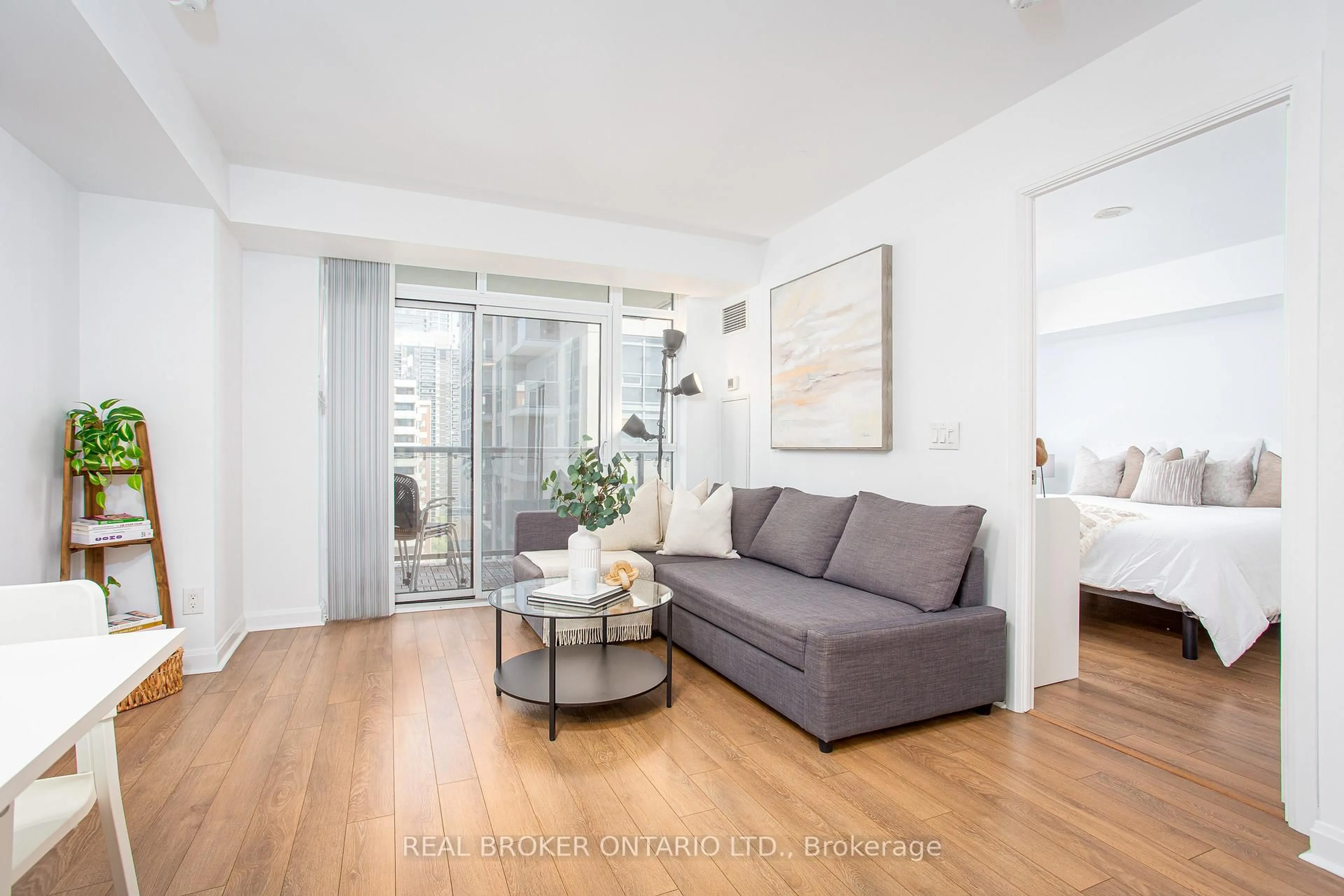 Living room with furniture, wood/laminate floor for 1 Michael Power Pl #1603, Toronto Ontario M9A 0A1
