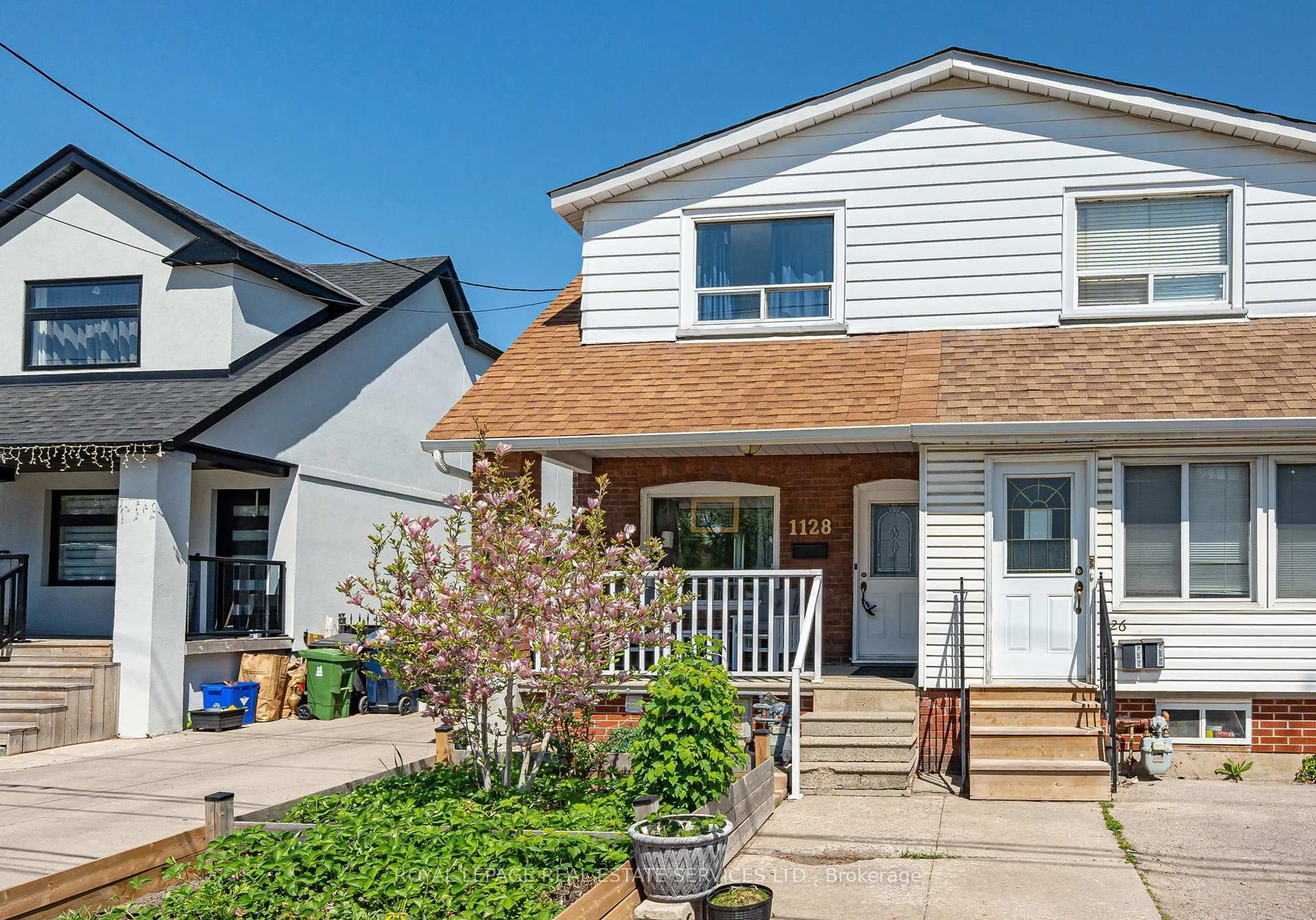 Home with vinyl exterior material, street for 1128 Roselawn Ave, Toronto Ontario M6B 1C4