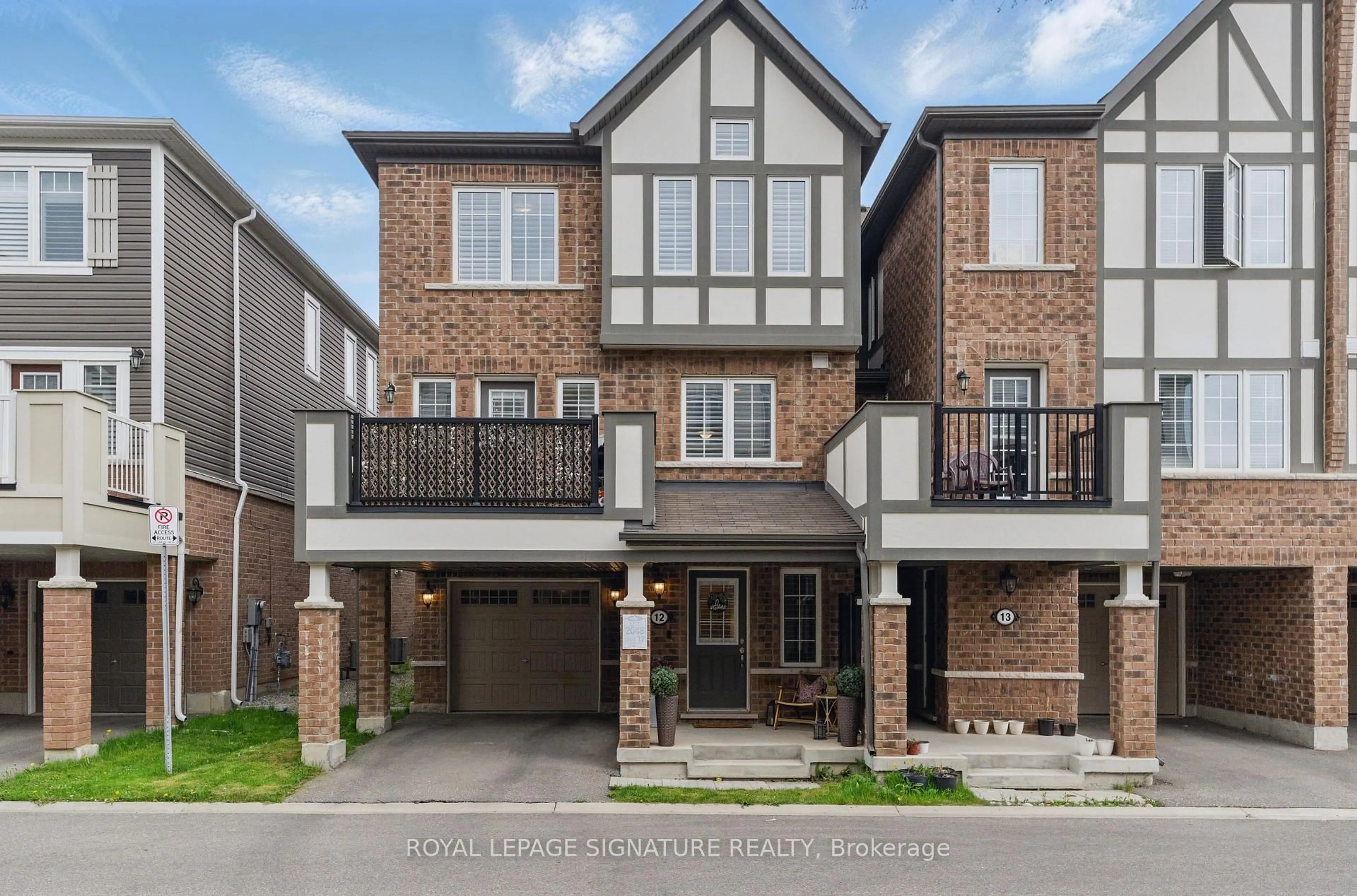 Home with brick exterior material, street for 1222 Rose Way #12, Milton Ontario L9E 1P2