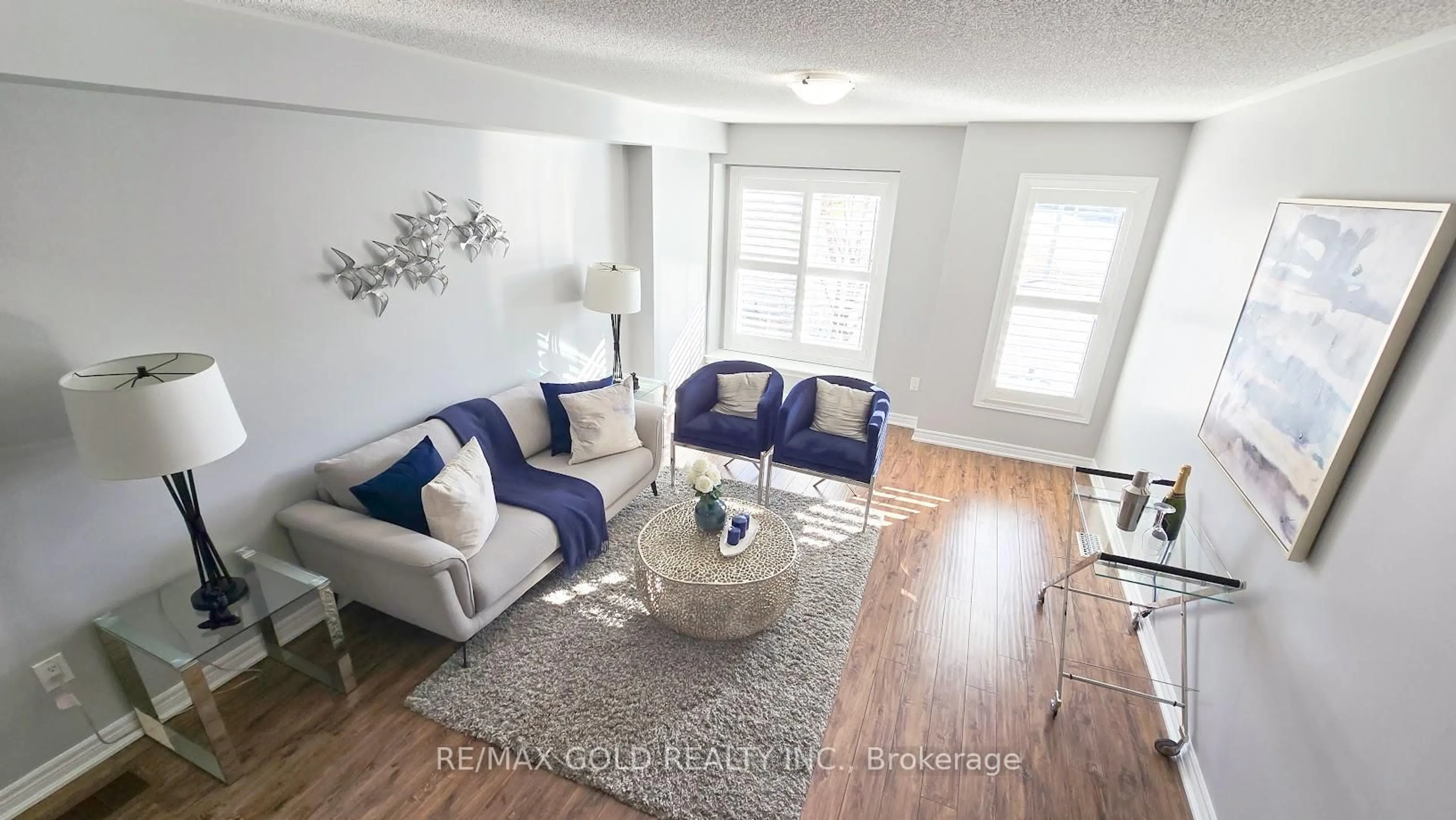 Living room with furniture, wood/laminate floor for 8 Tilden Rd, Brampton Ontario L6R 0W5
