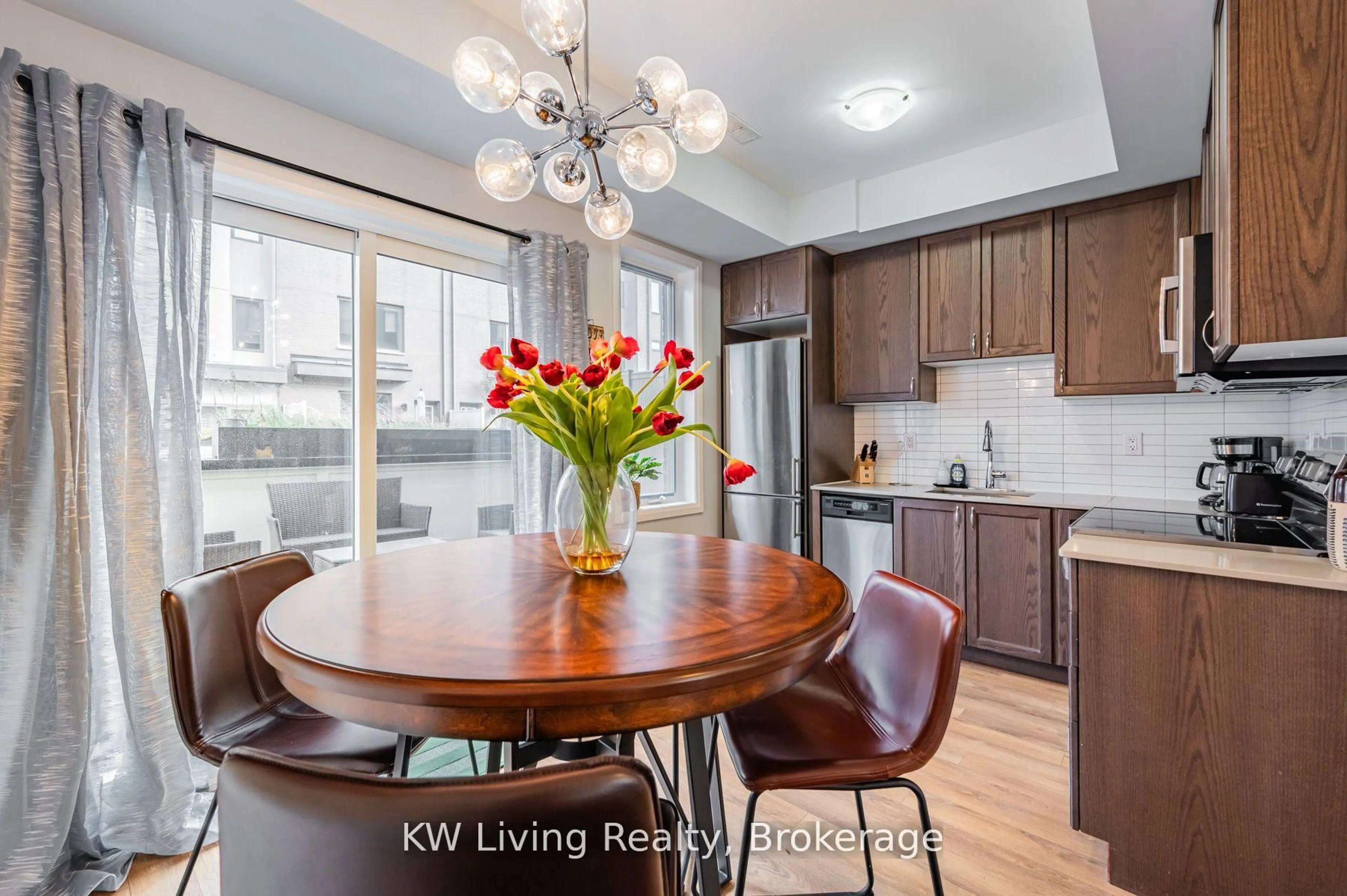 Open concept kitchen, wood/laminate floor for 21 Caroline Carpenter Grve, Toronto Ontario M3K 0B1
